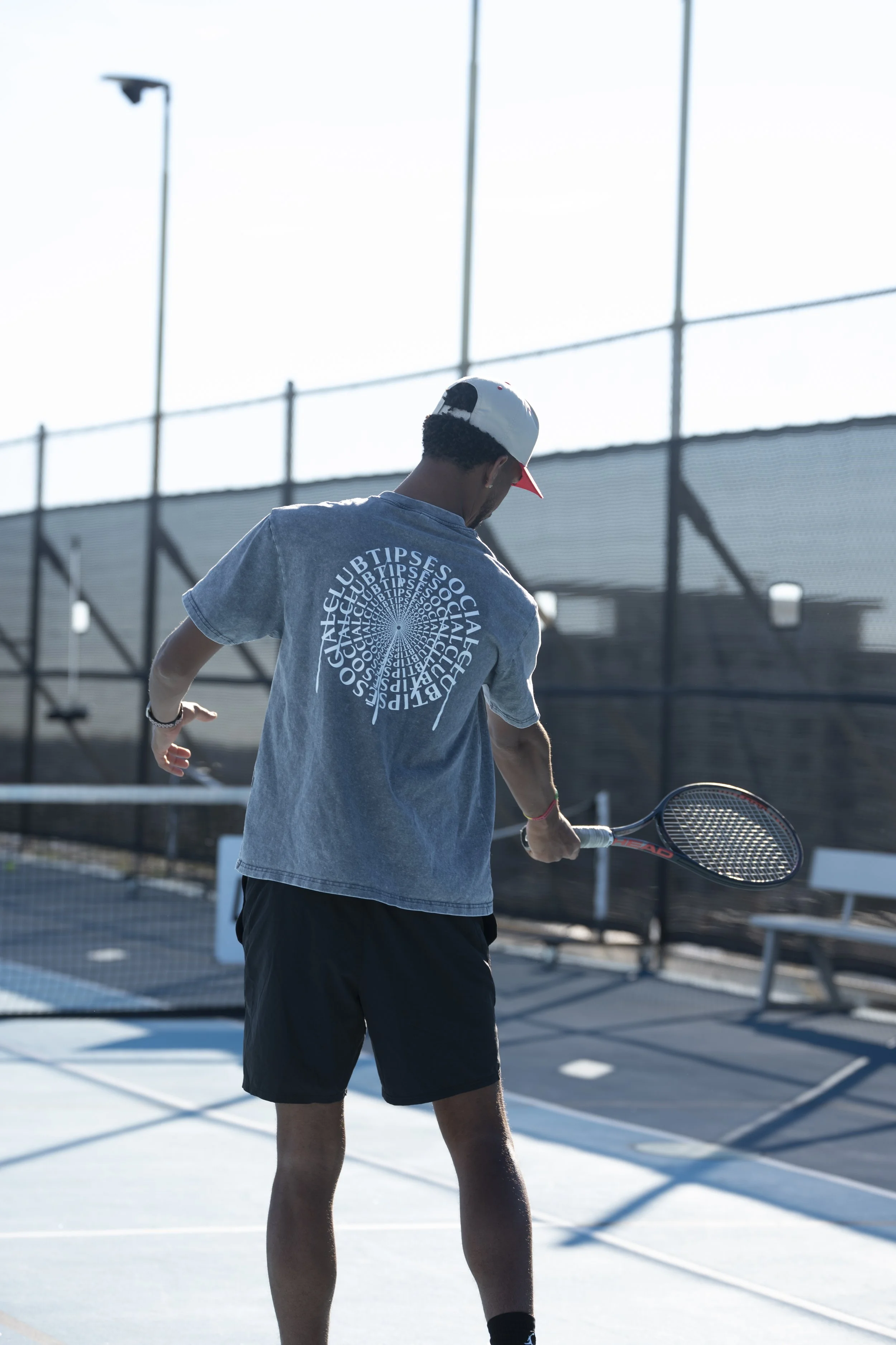 "Tipsē Social Club Drip Spiral” Acid Wash Tee