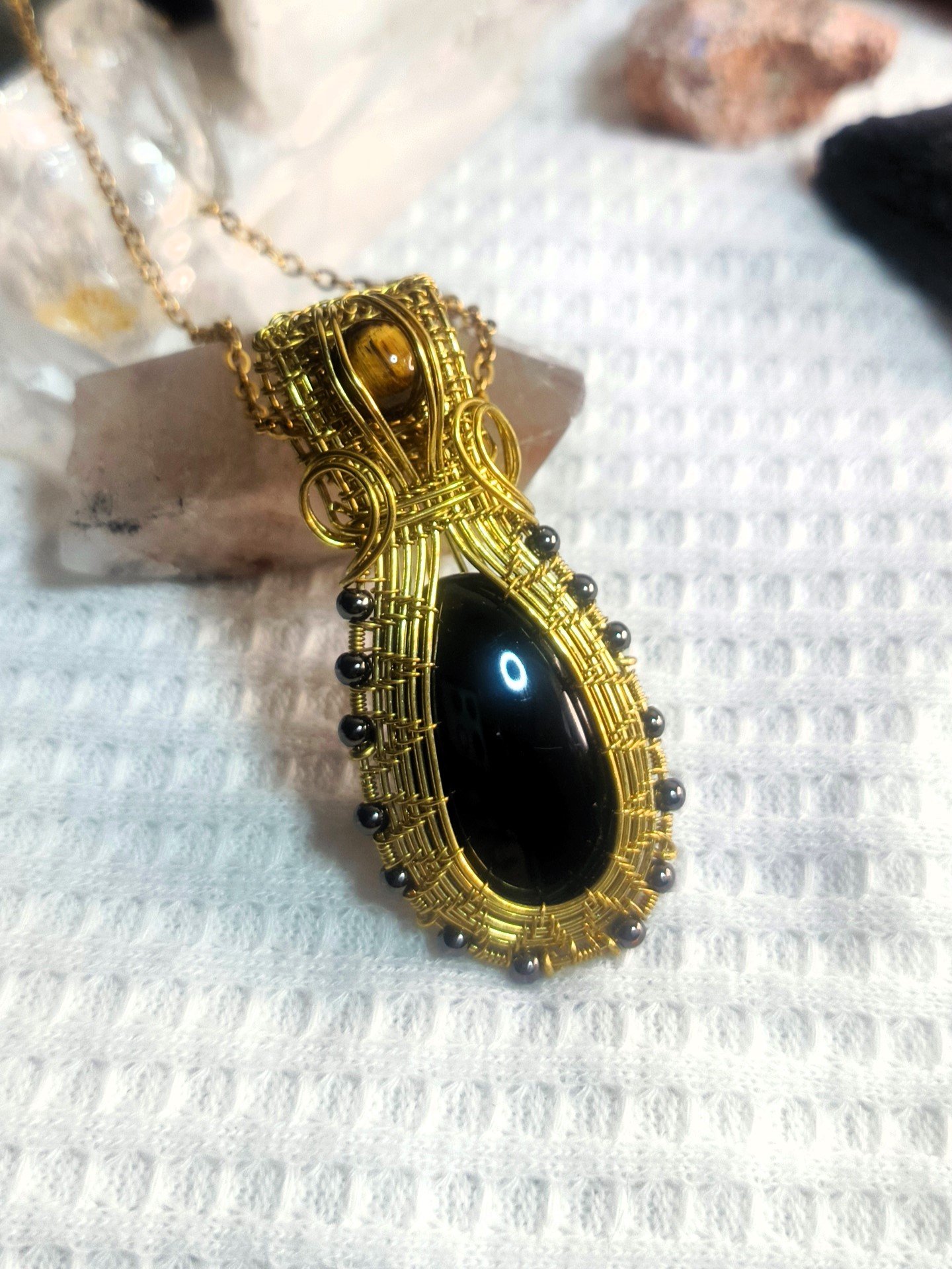 Dije en bronce obsidiana y ojo de tigre3x4 (2).jpg