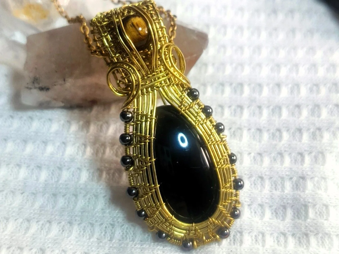 Dije en bronce Obsidiana y Ojo de tigre collar joyería artesanal Buena Madre