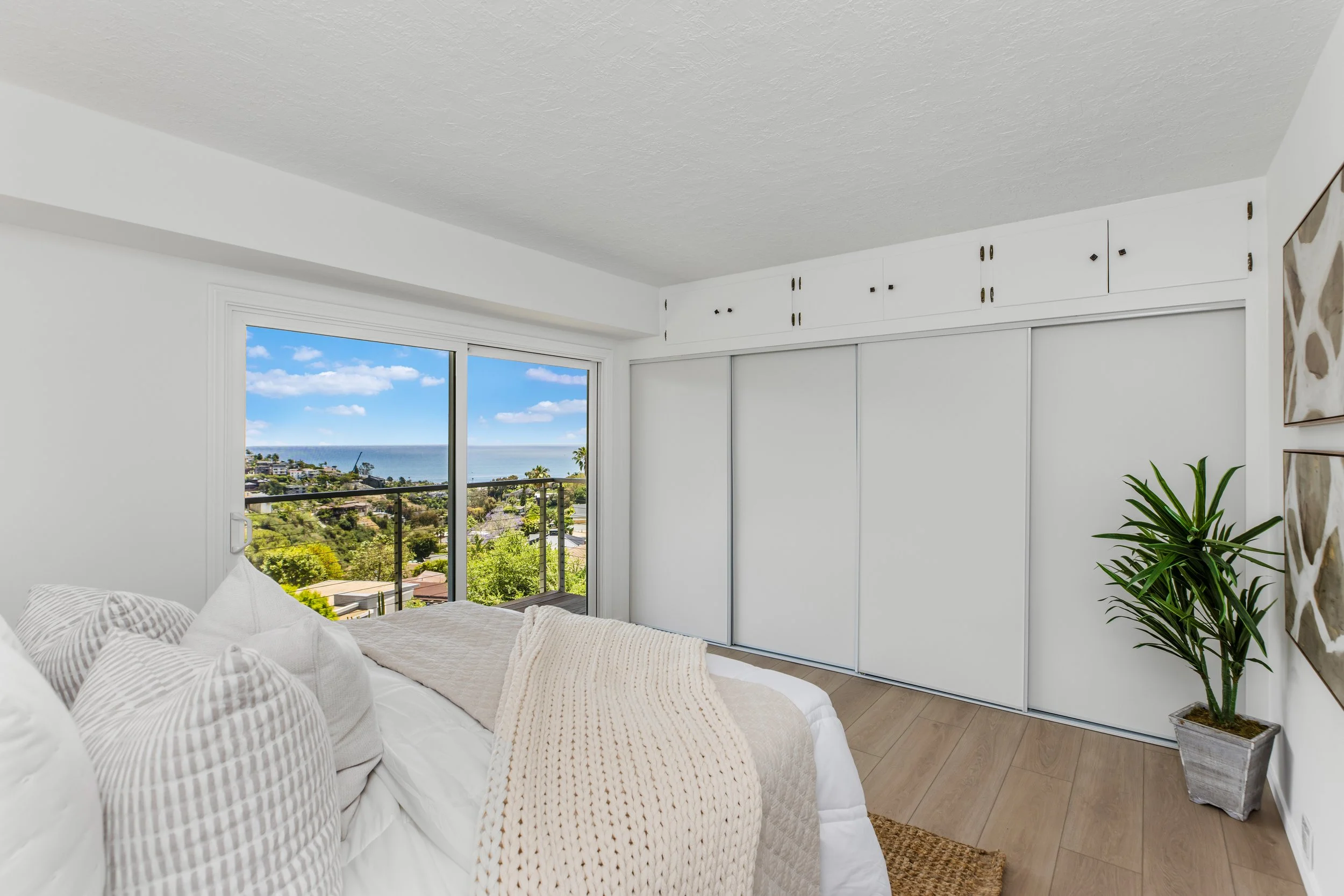 One of 3 bedrooms on the lower level. Each bedroom features an ocean view and access to a ocean view balcony
