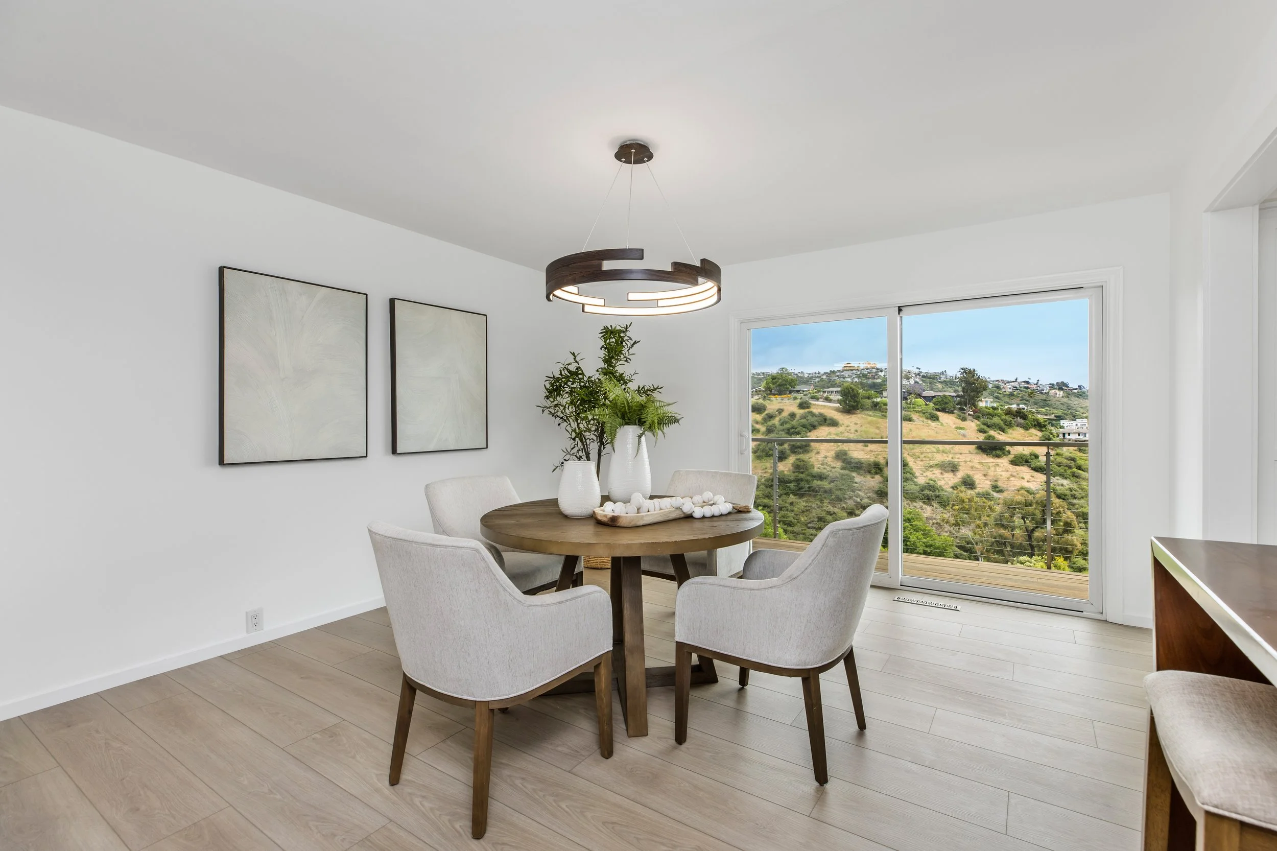 Formal dining room with sliding glass doors that lead to the ocean view terrace.