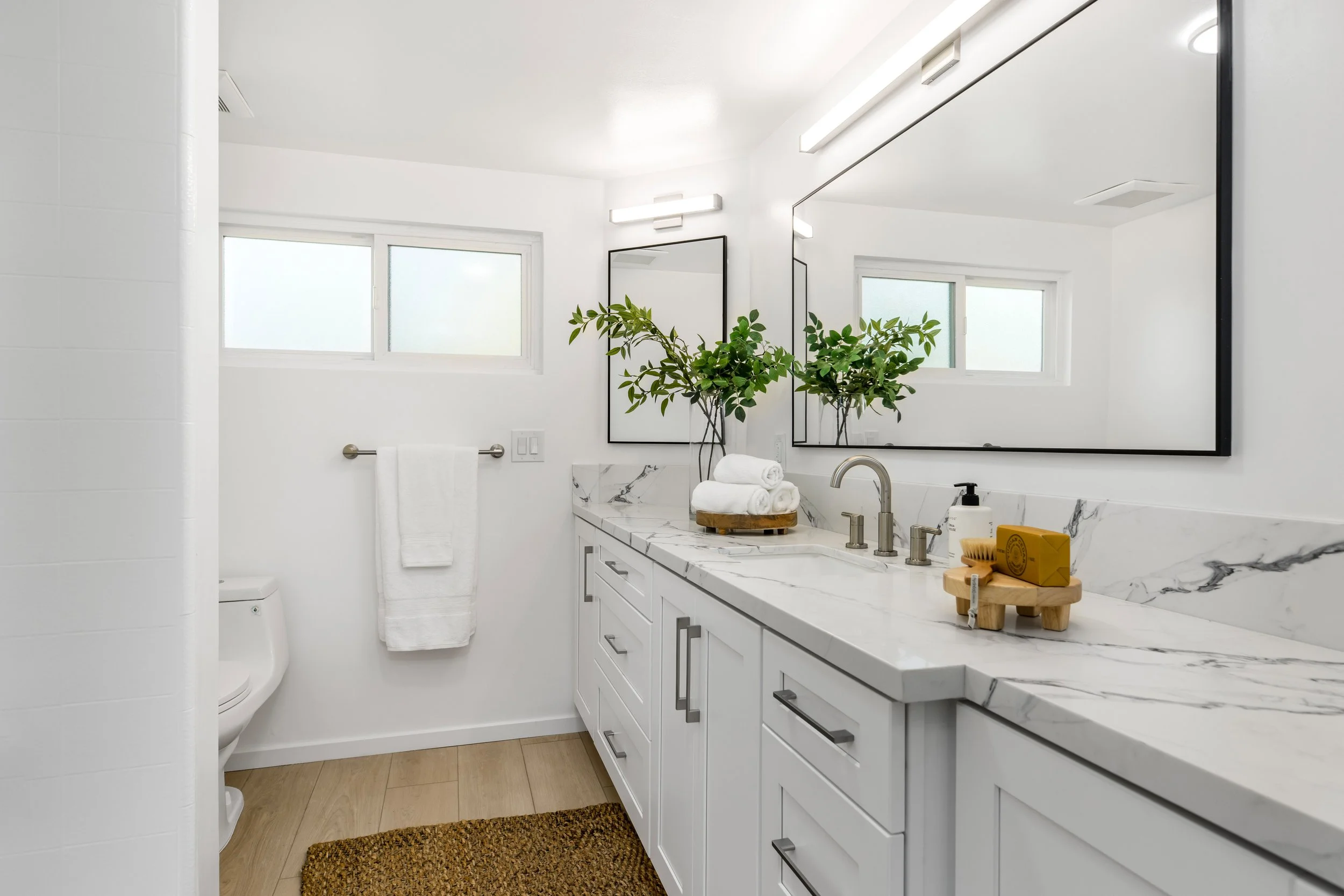 Remodeled main floor bathroom. Upgraded with custom cabinetry, and premium quartz counter tops.