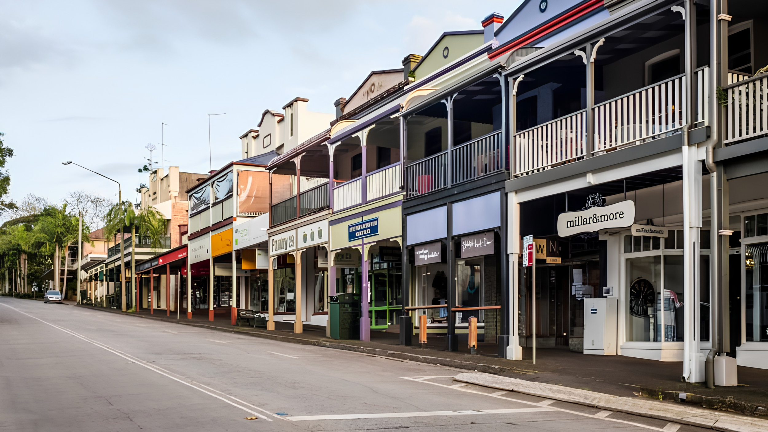 Bangalow NSW main street with colourful shopfronts, an Oke Building service area