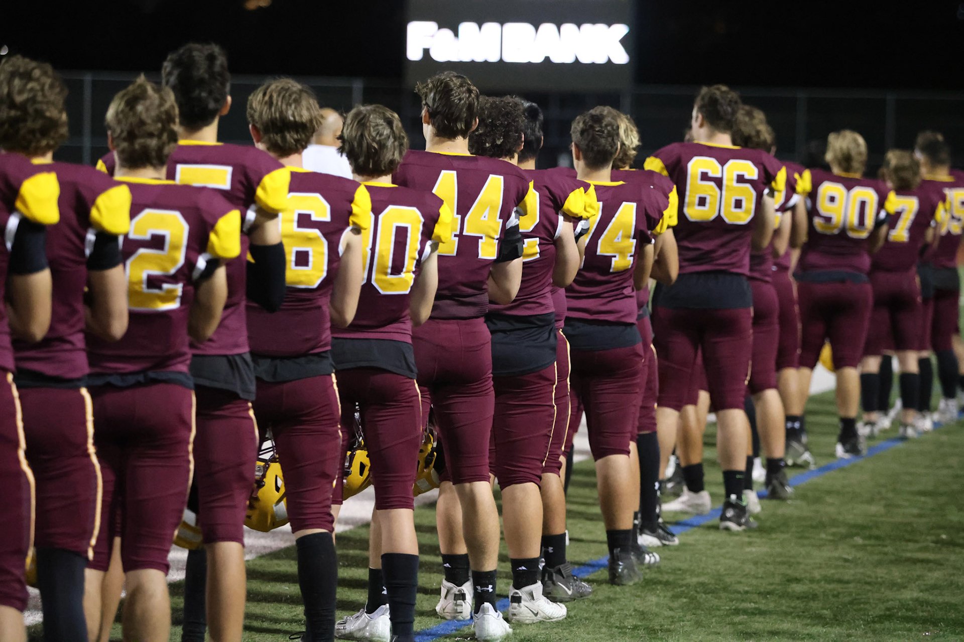 Back of player at anthem with FM Bank blurred in background.jpg