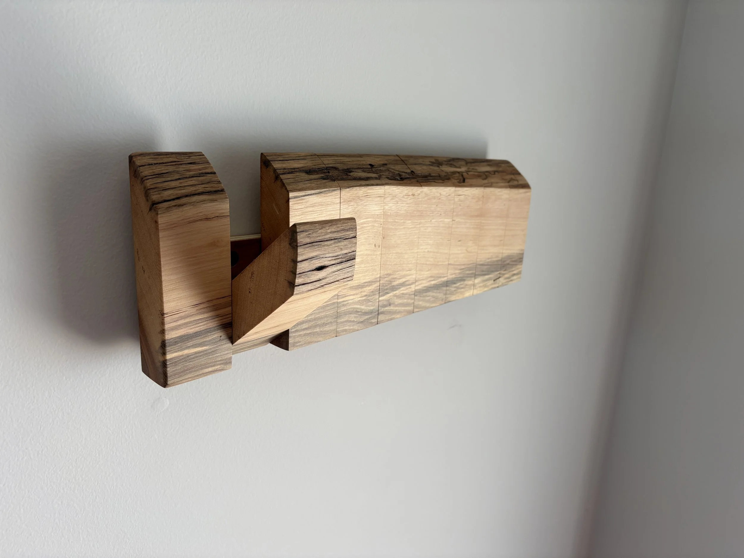 live edge spalted hickory folding coat rack on white wall