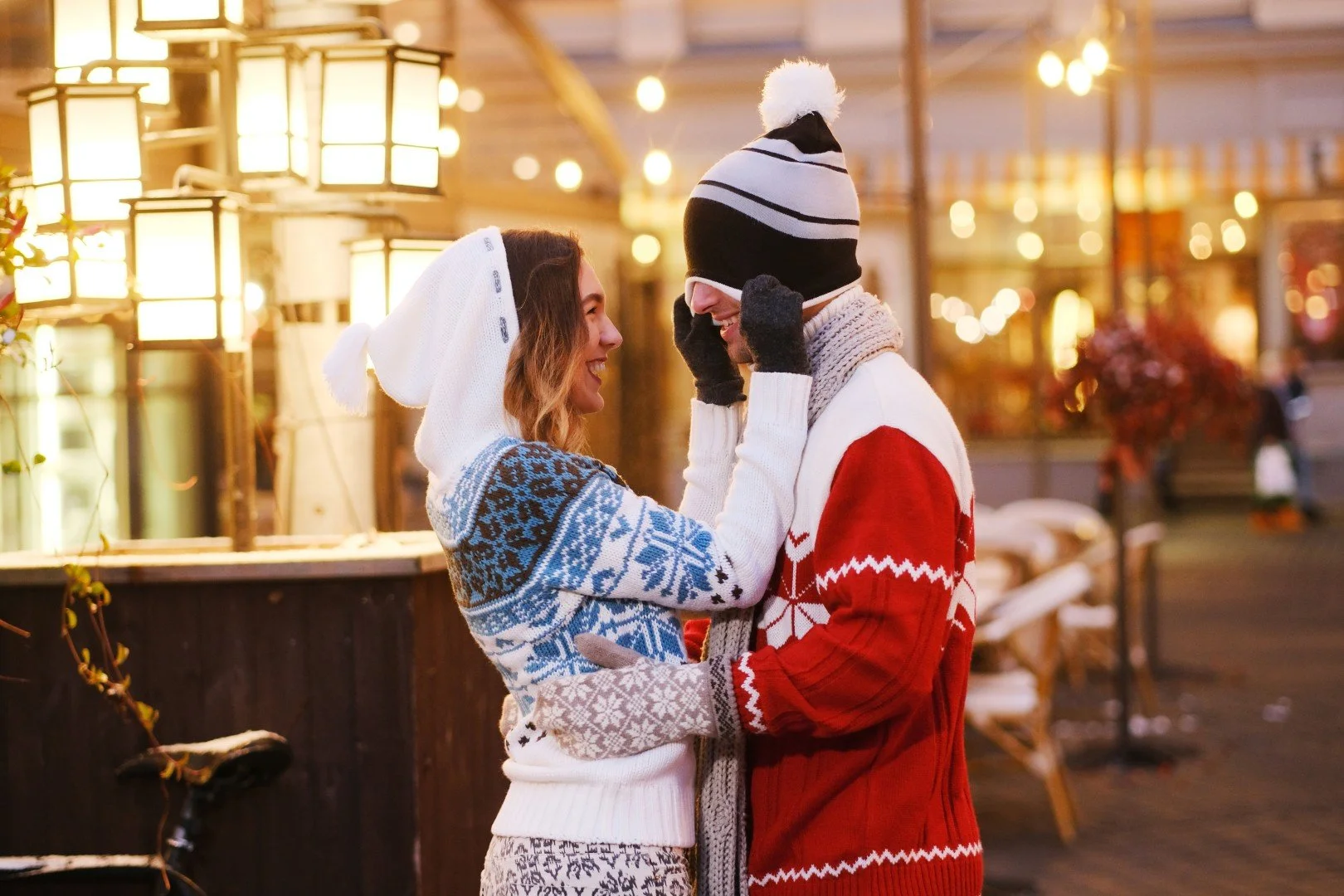 young-woman-have-fun-with-her-boyfriend-his-hat-while-walking-christmas-market (Large).jpg