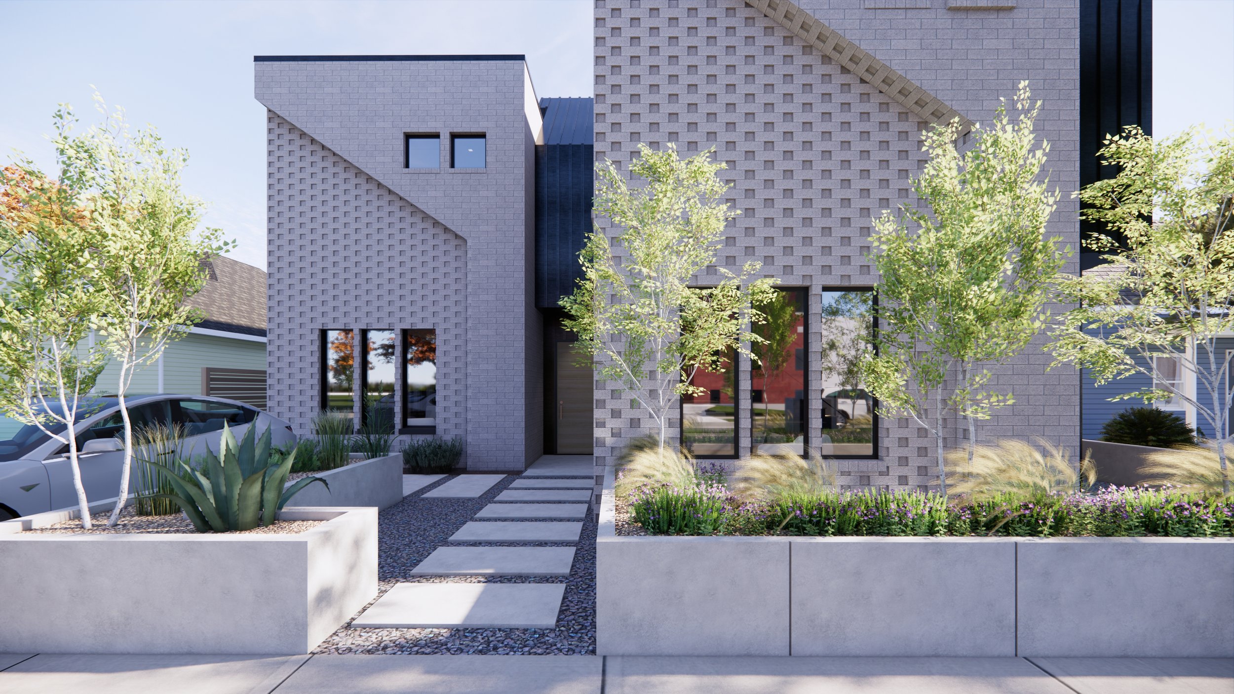 Modern two-story house with gray brick facade, black vertical siding, and large windows, surrounded by trees with autumn foliage, parked car, and bicycles on the sidewalk.