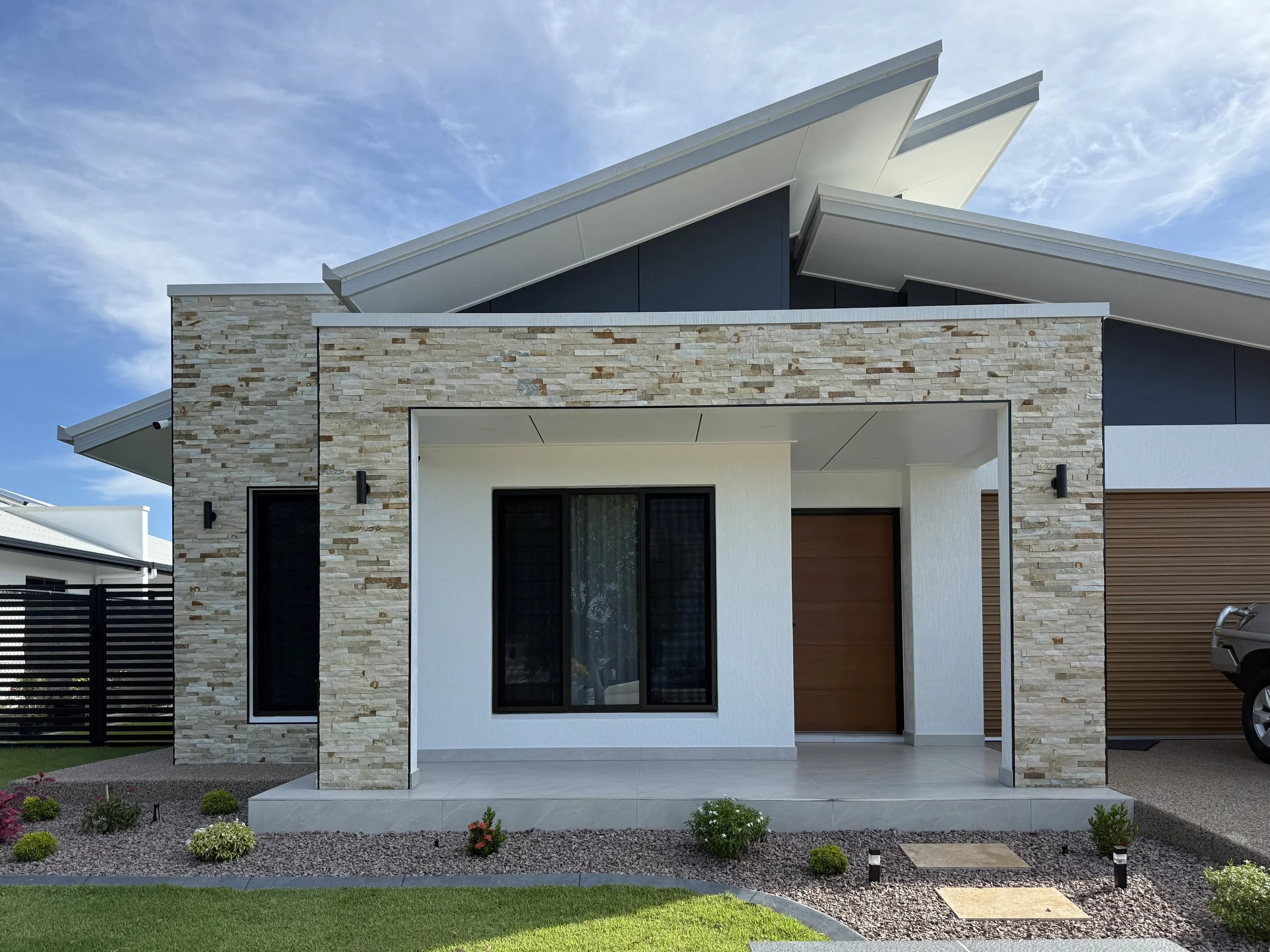 Natural stone tiling on a house exterior in Darwin NT by Estiling Tiling