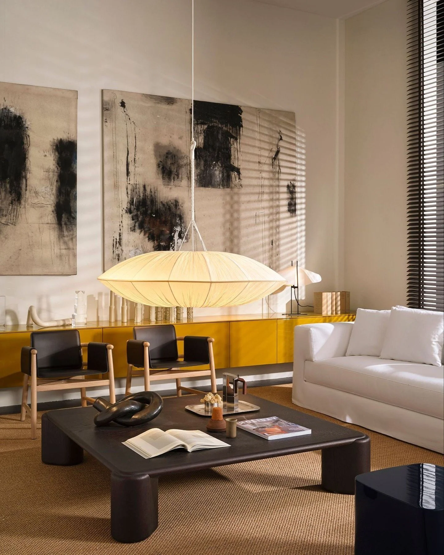 This is a living room for slow mornings and long evenings &mdash; where materials speak softly, proportions feel right, and time seems to stretch just a little.

The Roger Ghost sofa invites you to sink in without interruption &mdash; its soft drape 