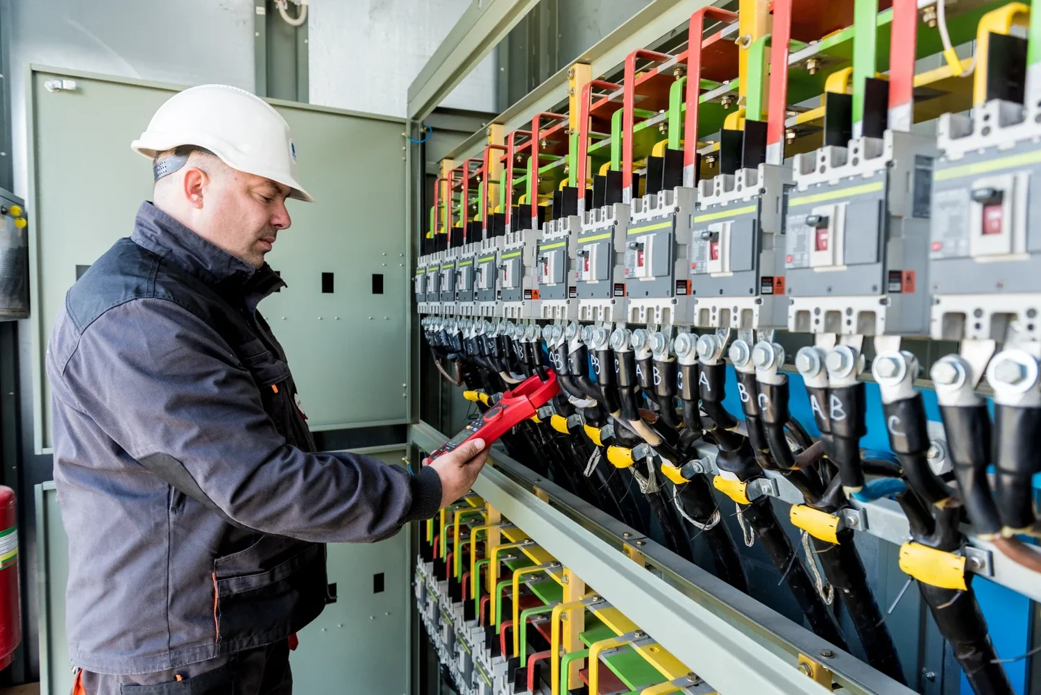 Self-employed tradesperson in the UK — electrician working on a job.