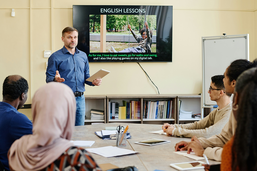 Language learning apps and platforms on a phone and laptop for people living in the UK