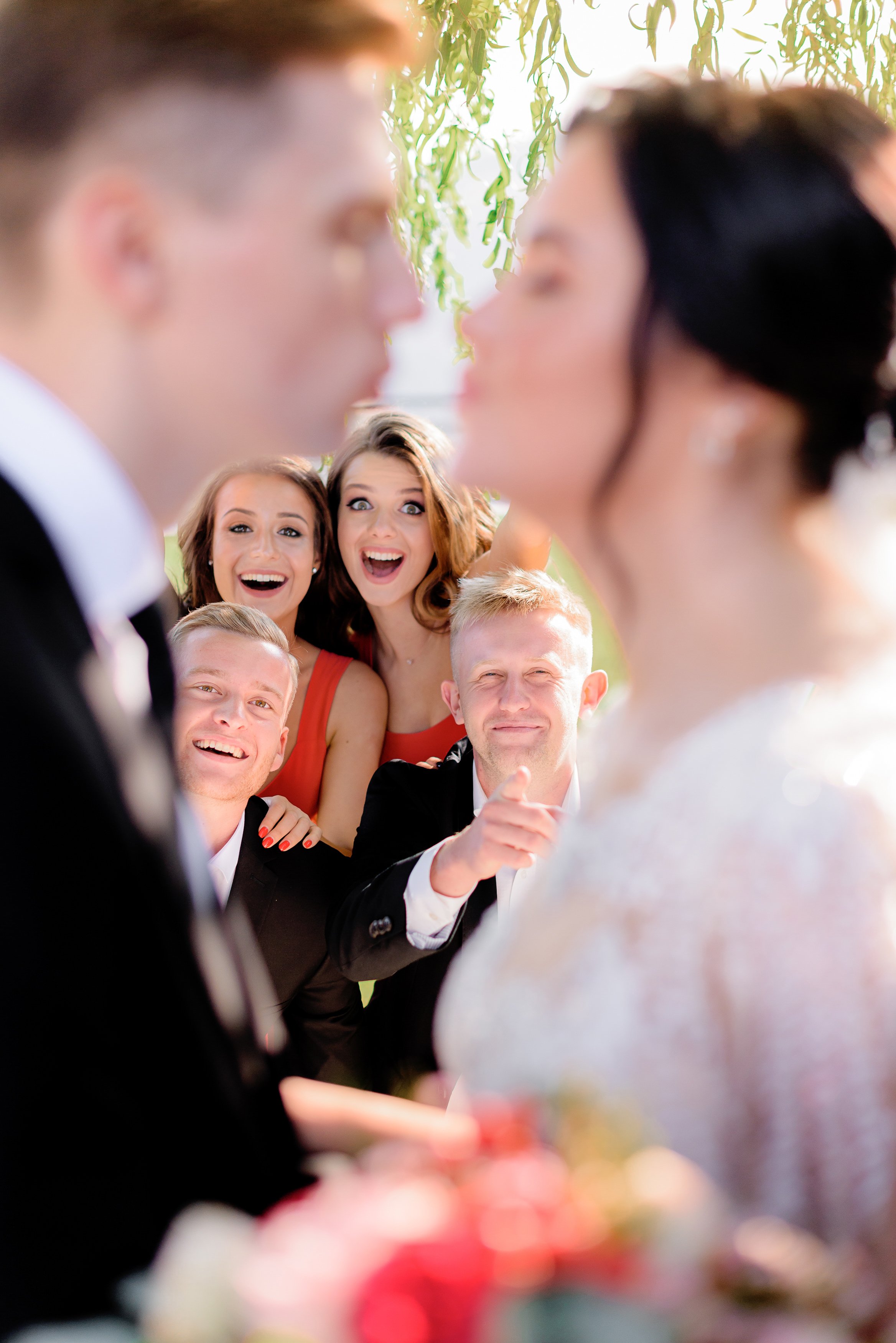 blurred-wedding-couple-with-happy-smiled-guests-background-outside.jpg