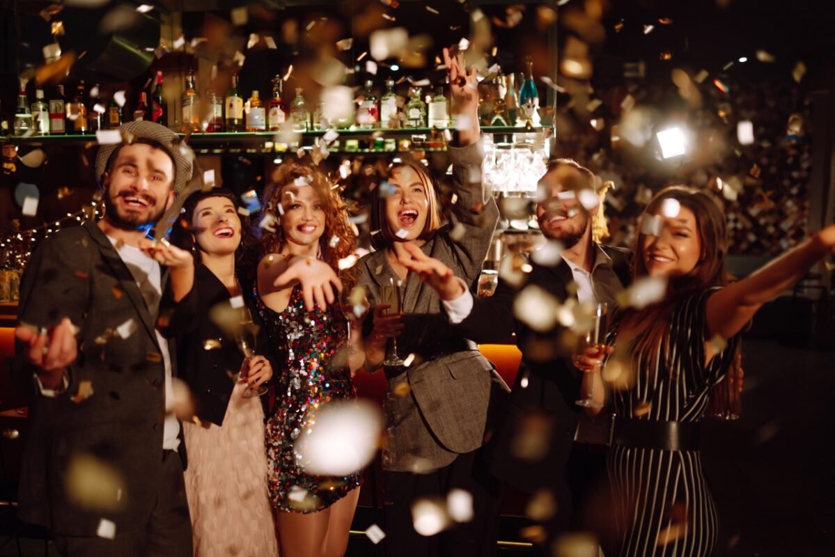 happy-friends-throwing-confetti-and-jumping-while-2022-11-01-02-56-22-utc-Large-1199x800.jpeg