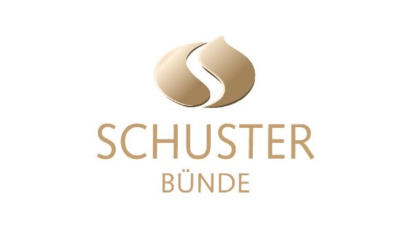 Logo mit zwei stilisierten, braunen Wahrzeichen und dem Text 'Schuster Bünde' darunter.