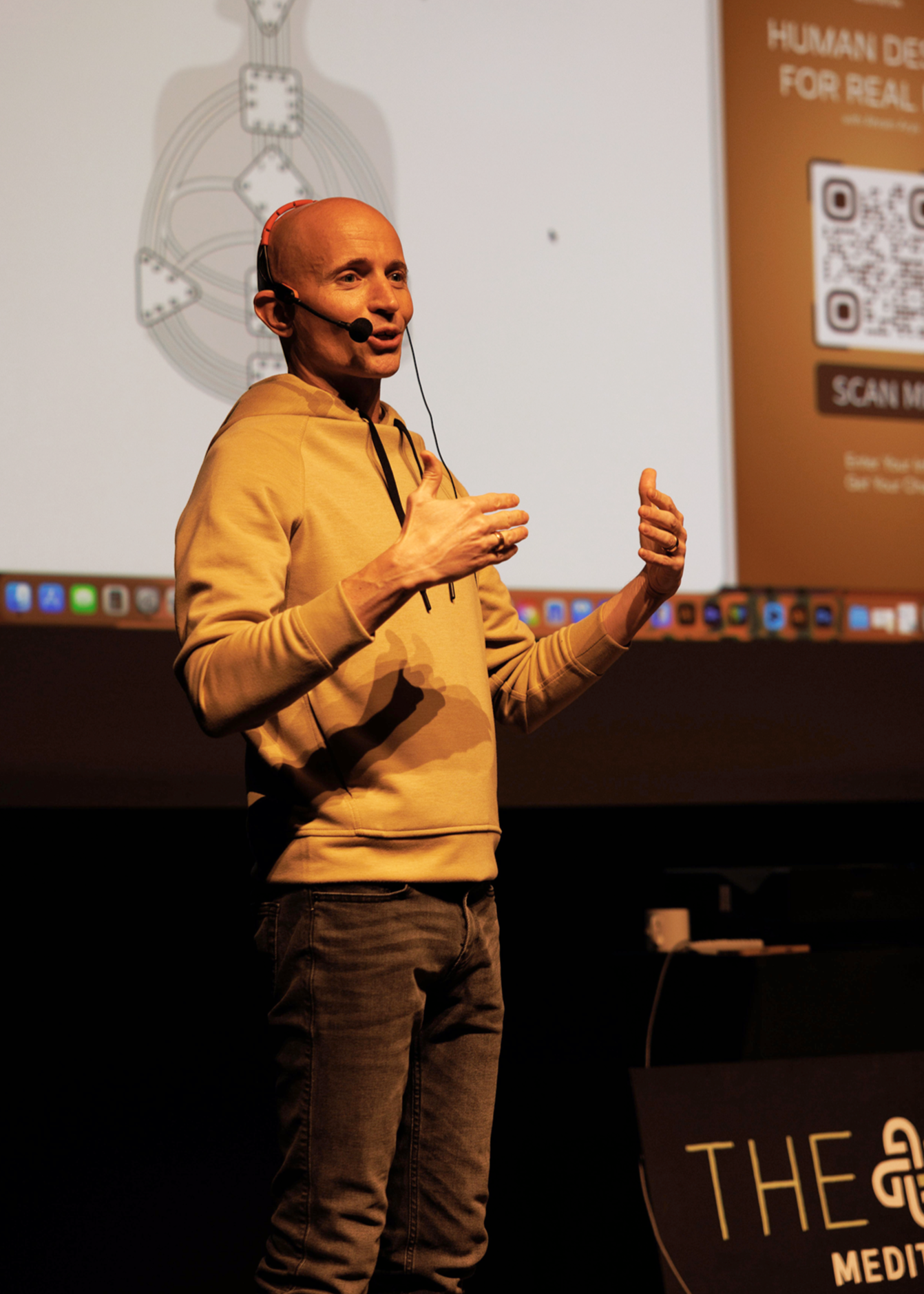 Image of Ahram Arya giving the keynote speech for the human design experience with DEN Meditation live at the London Hotel West Hollywood