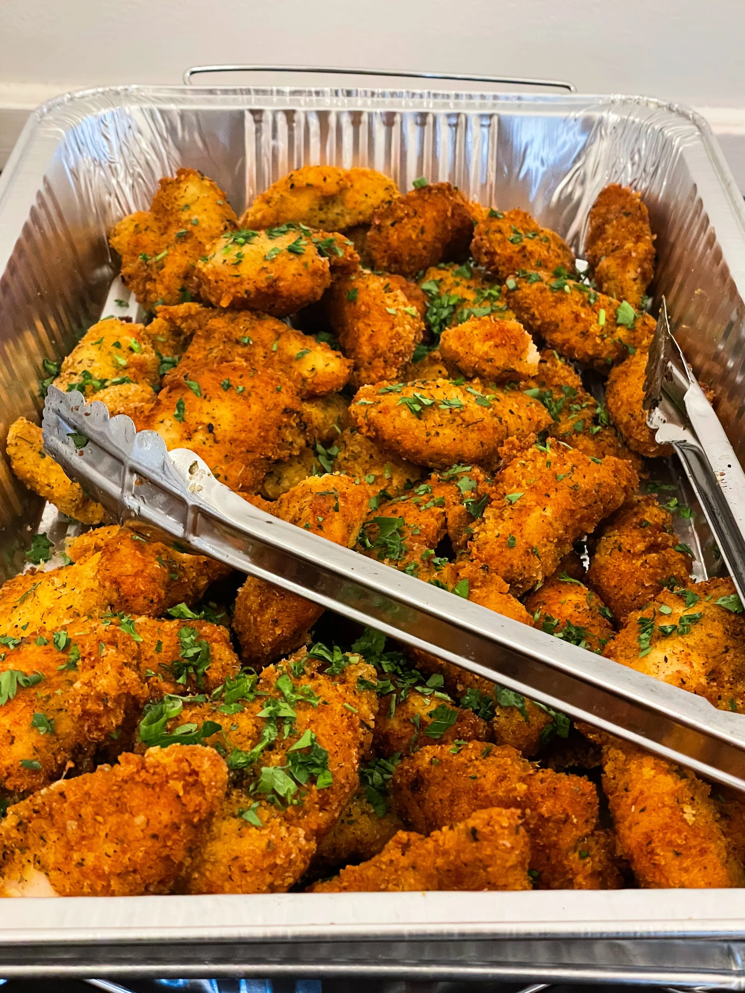 chicken tenders in a foil pan