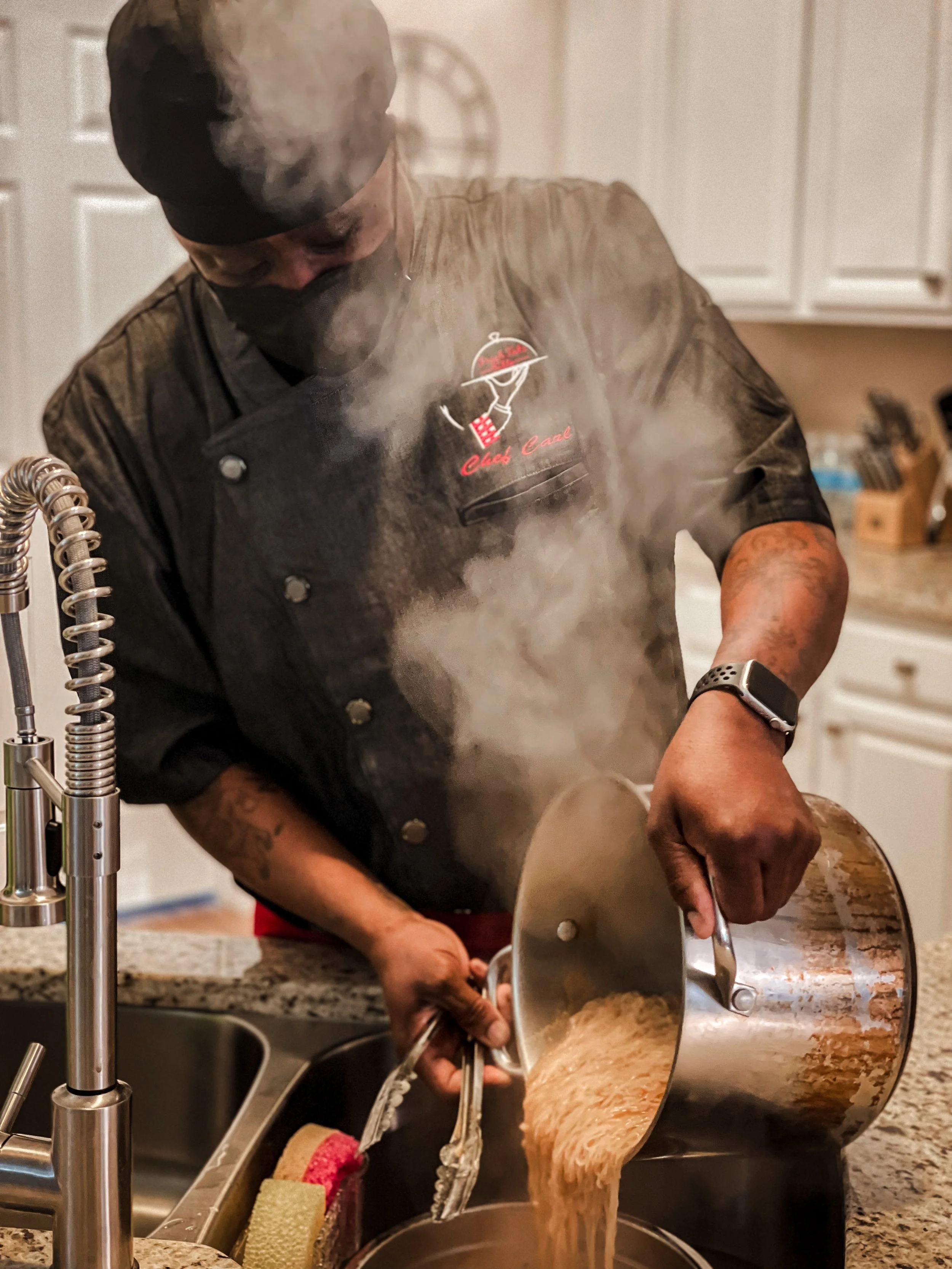 Chef Carl straining pasta from a pot of boiling water