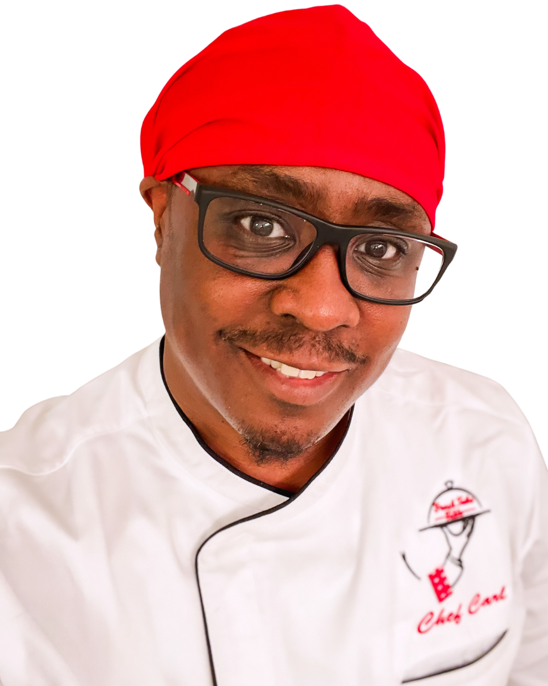 Chef Carl posing for a picture in a white chef coat