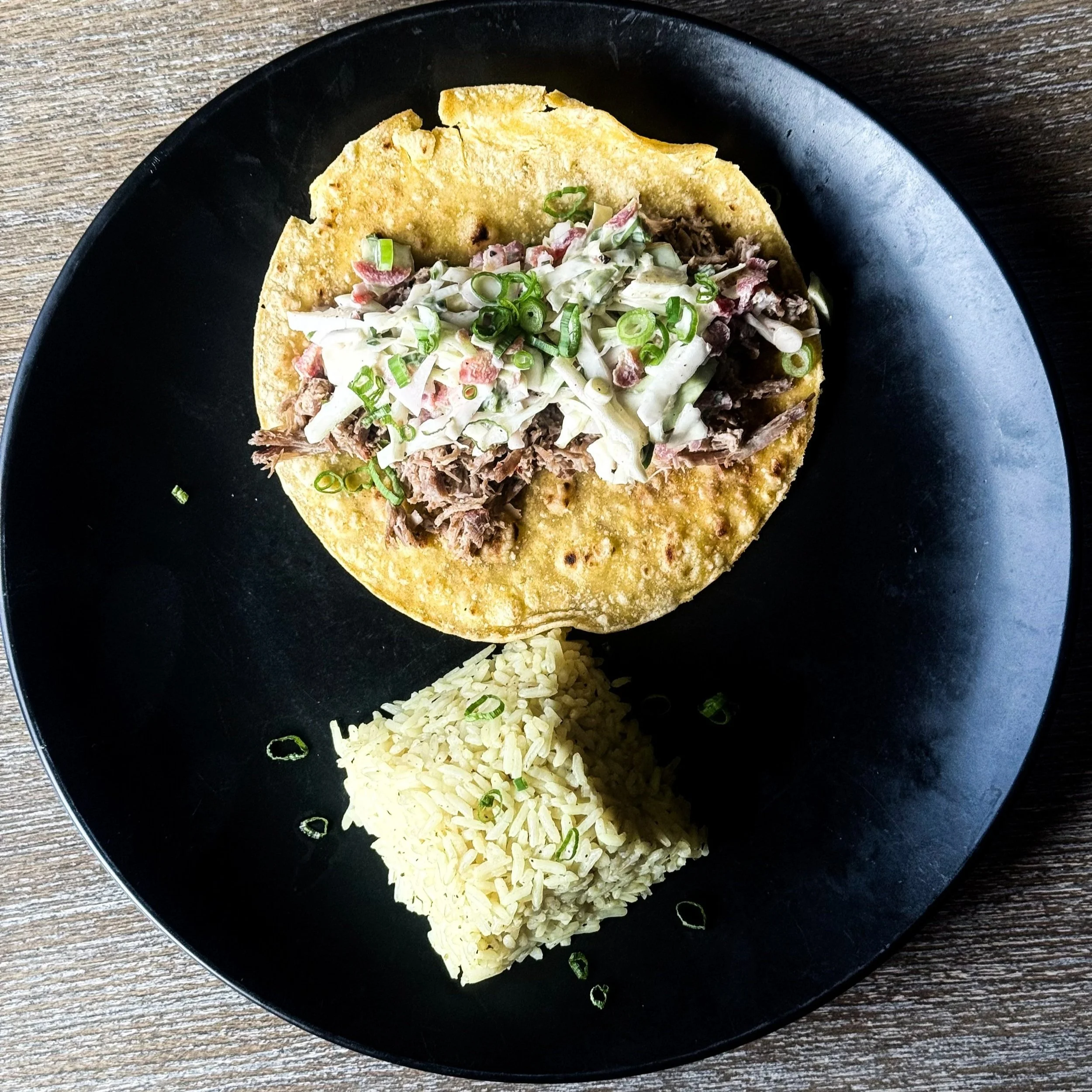 Carolina Pulled Pork Taco and rice on a plate
