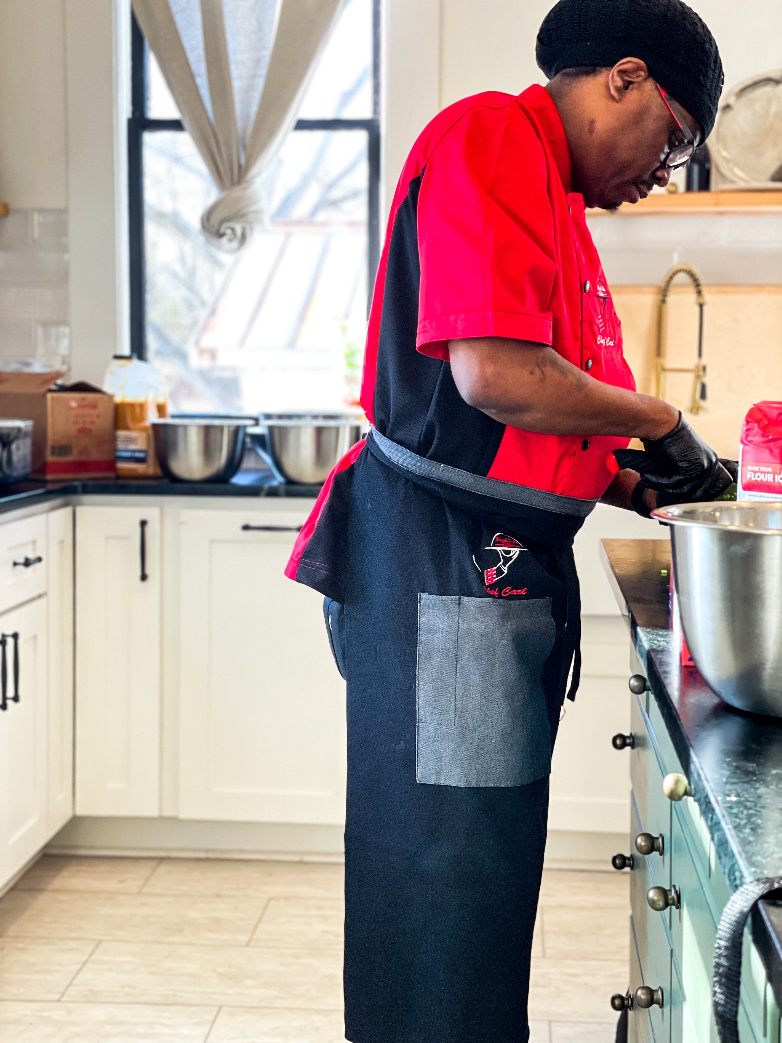 Chef Carl prepping food at a kitchen island