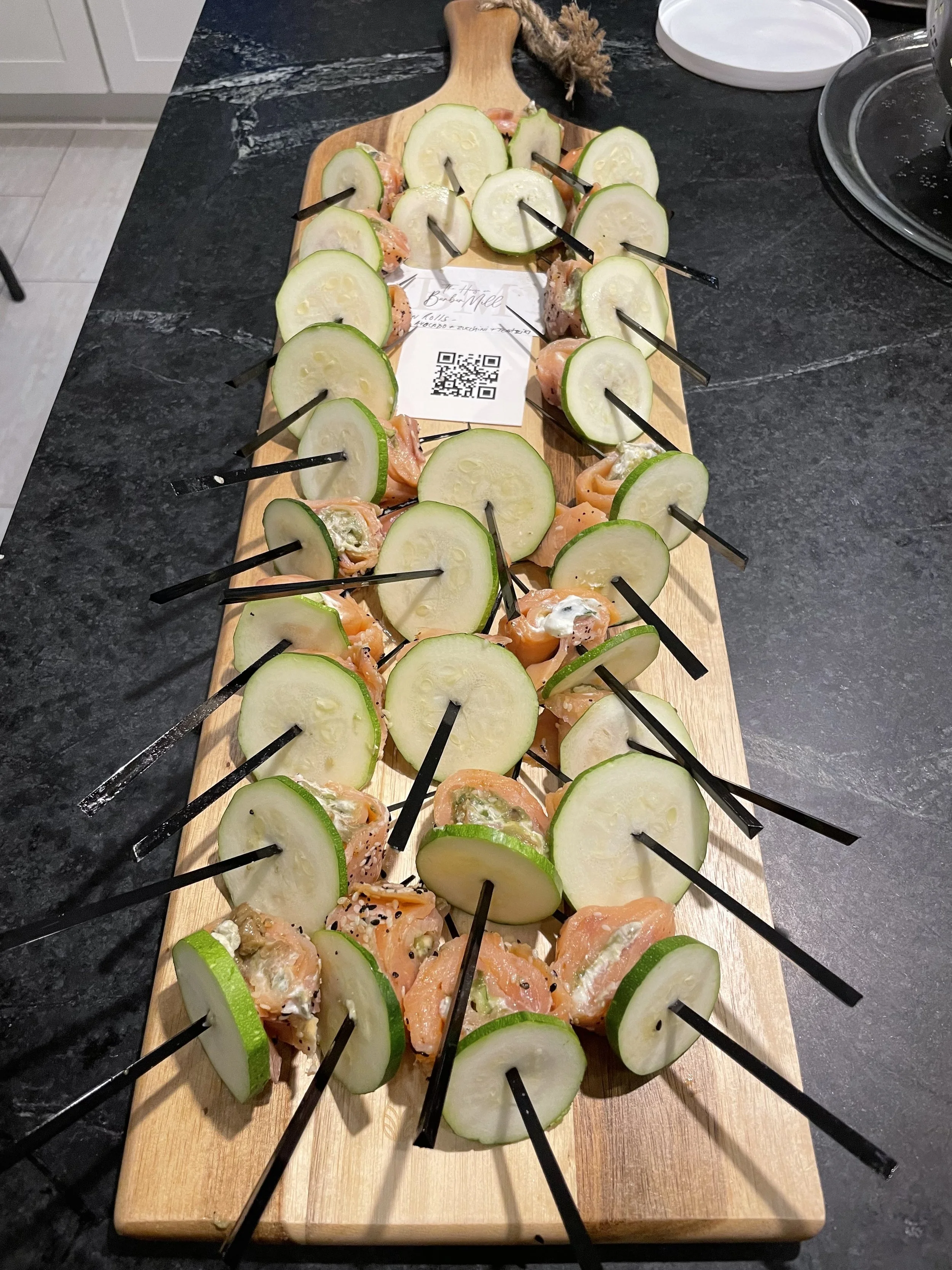 salmon rolls on a serving board