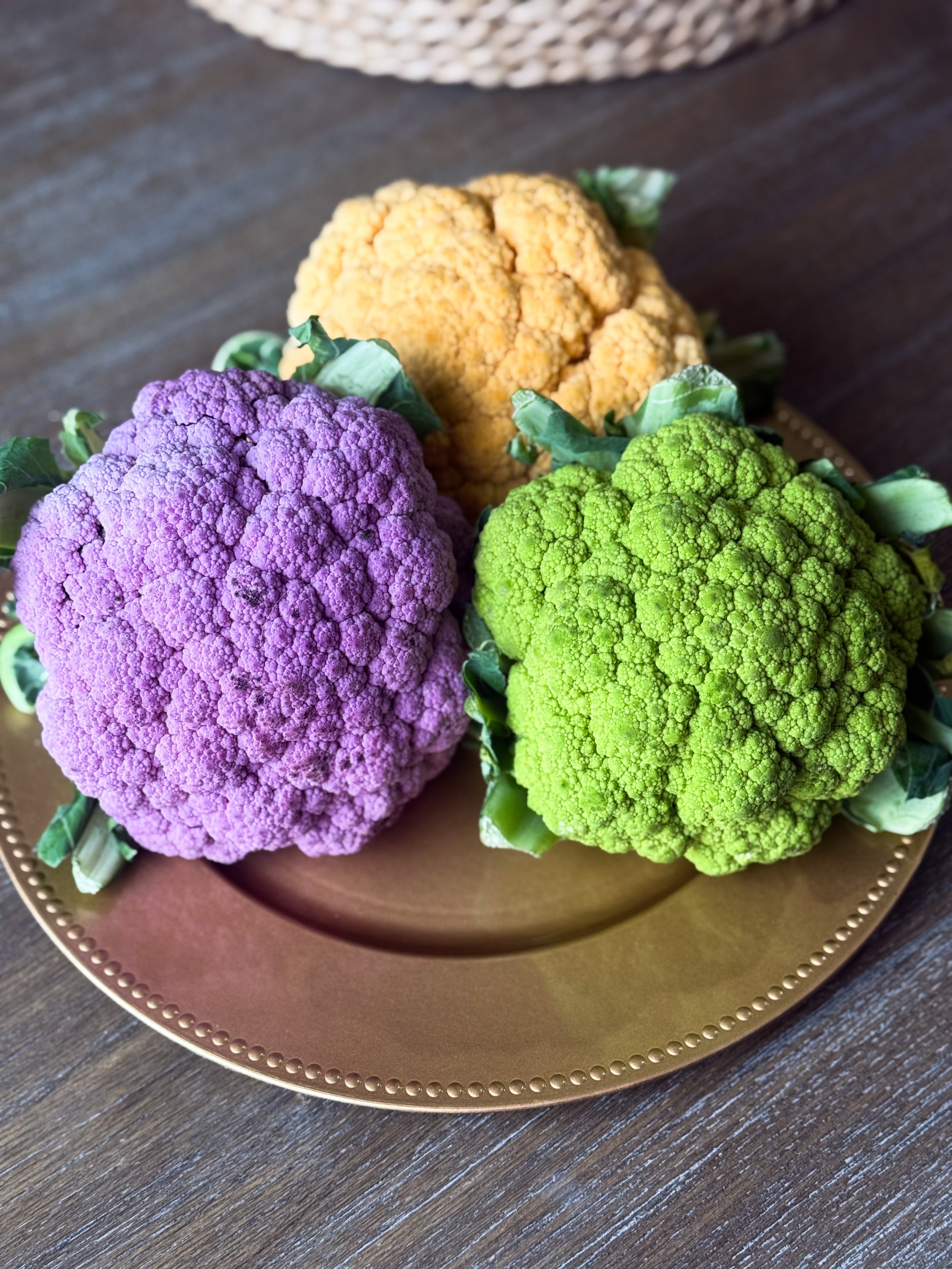 Tri-colored cauliflower heads on a platter