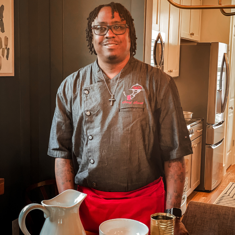 Personal Chef Carl Welch Jr standing at a dinner table
