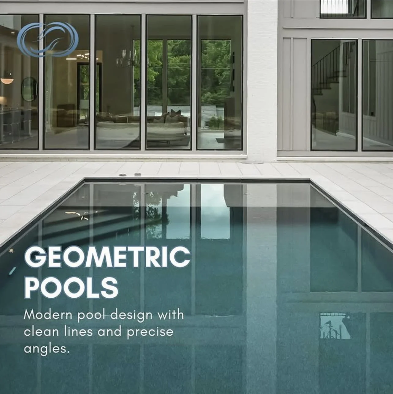 Modern residential backyard with a rectangular geometric pool, surrounded by white tiles, large glass sliding doors leading into the house, and interior visible through the windows.