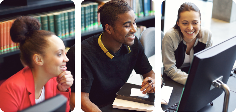 Three young adults sitting at a table in a library, engaged in a discussion while looking at a computer.