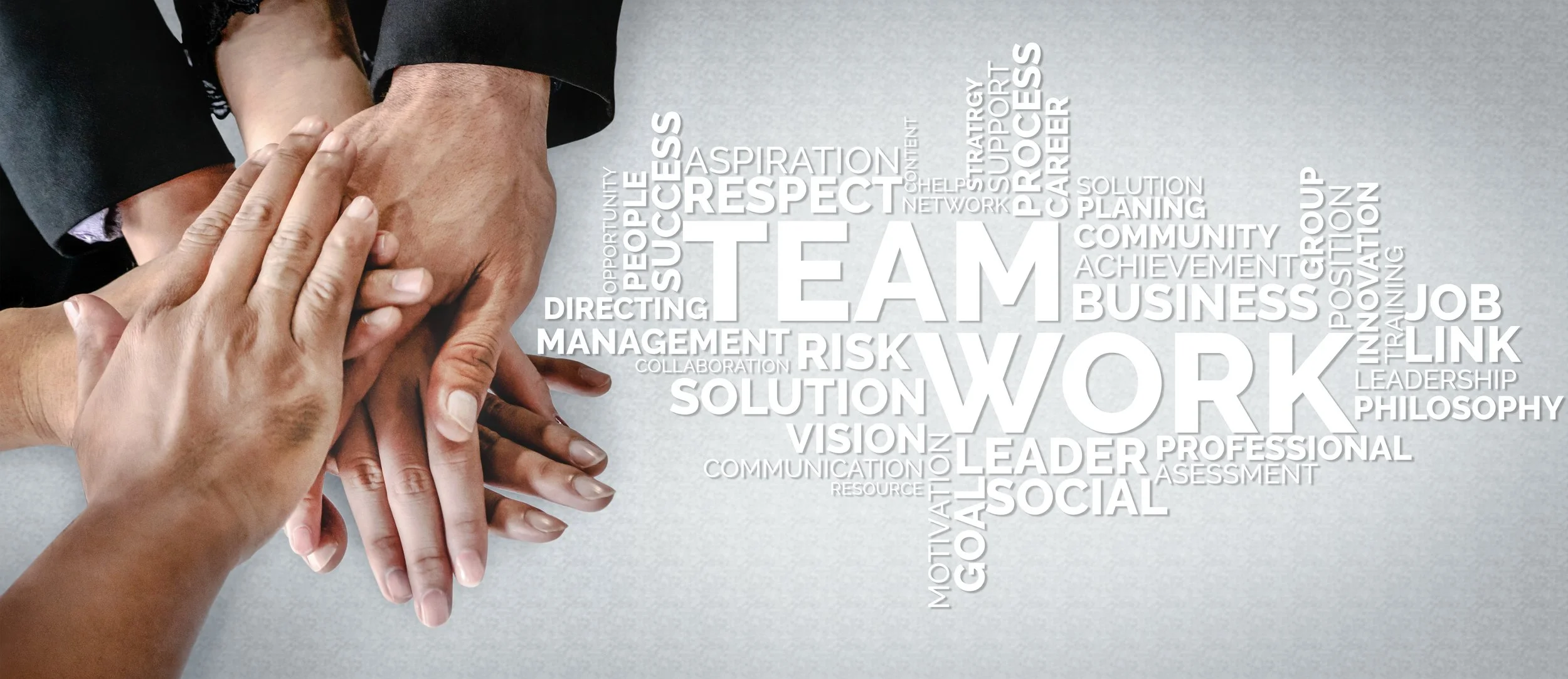 Multiple hands stacked together symbolizing teamwork, with a background word cloud containing words like 'TEAM,' 'WORK,' 'SUCCESS,' 'LEADERSHIP,' and 'COLLABORATION'.