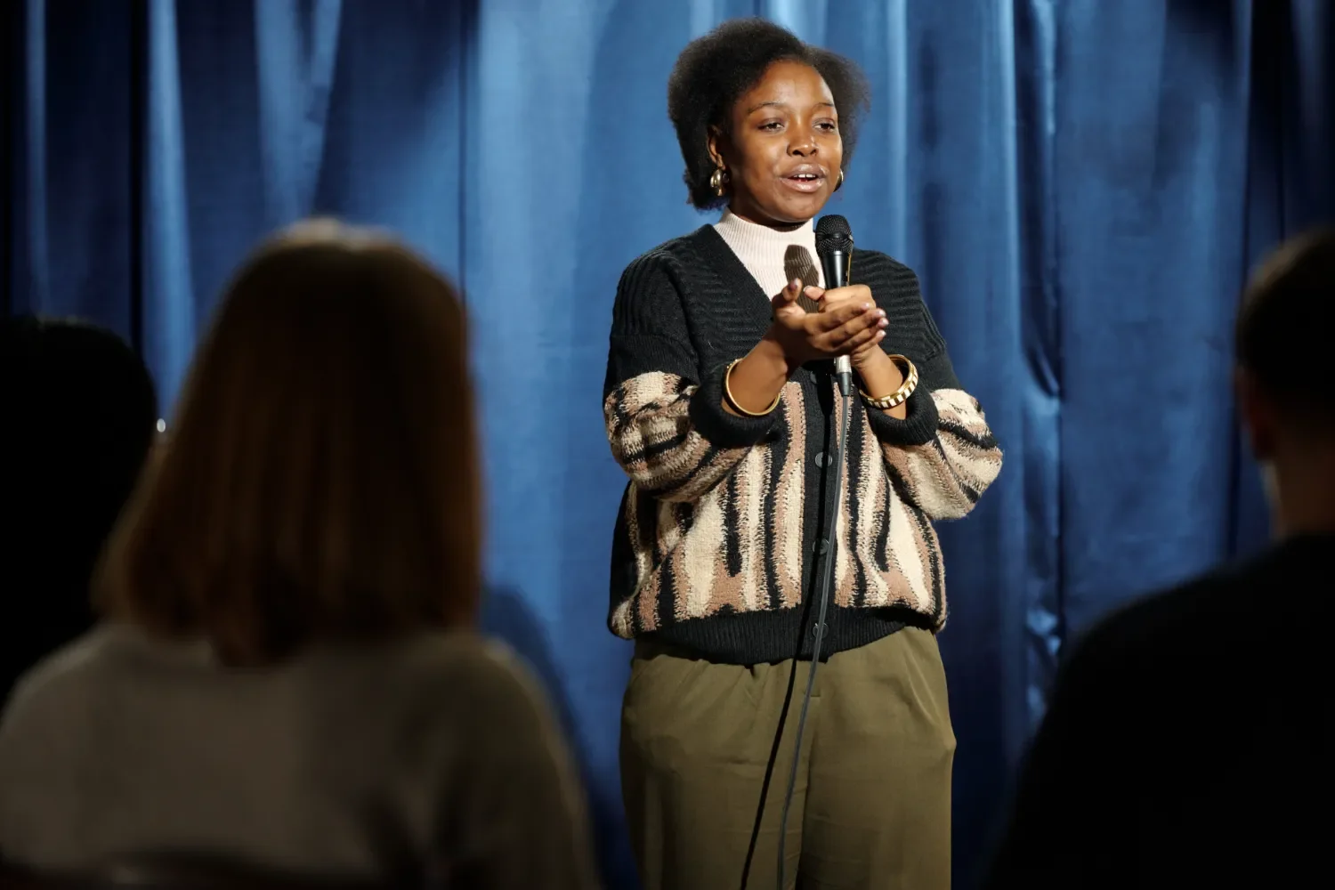 Young Female Comedian on Stage doing Stand Up Comedy