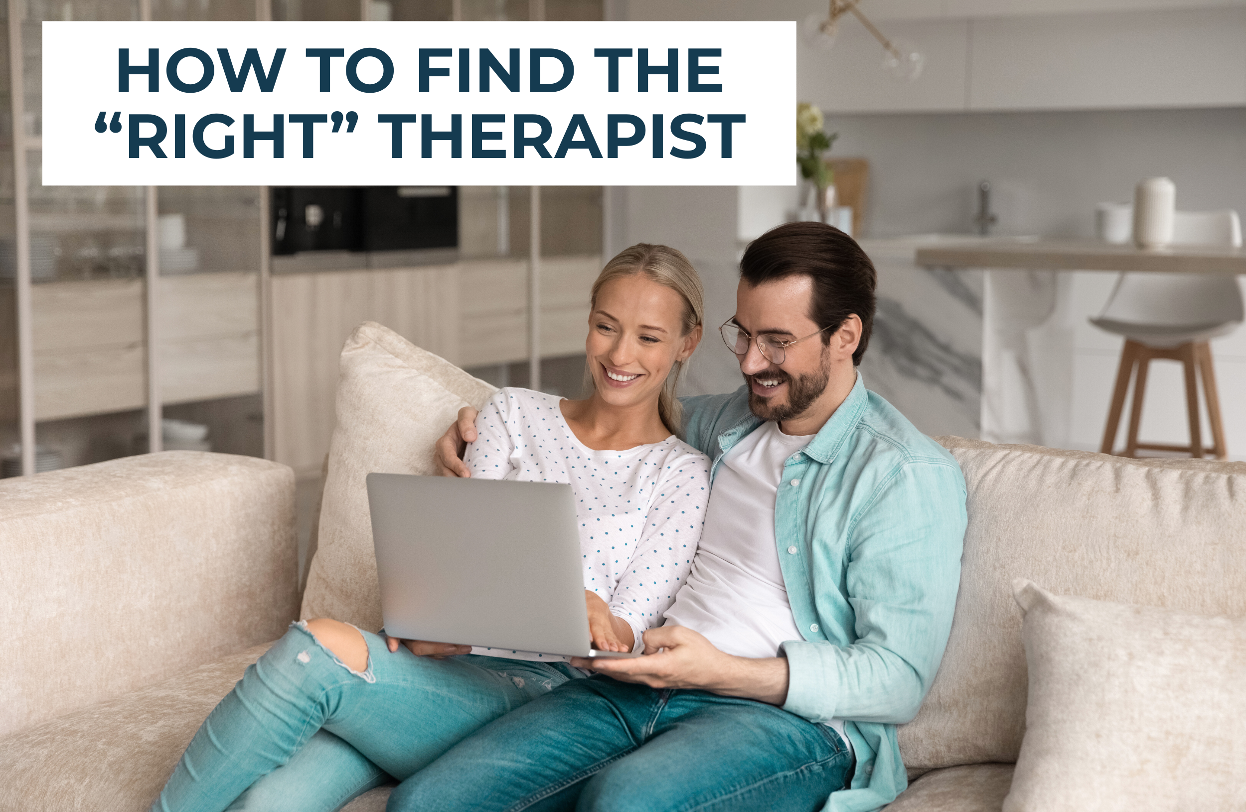 Couple sitting on couch smiling while searching for a therapist on a laptop, representing the process of finding the right couples therapist in Sarasota, Florida.