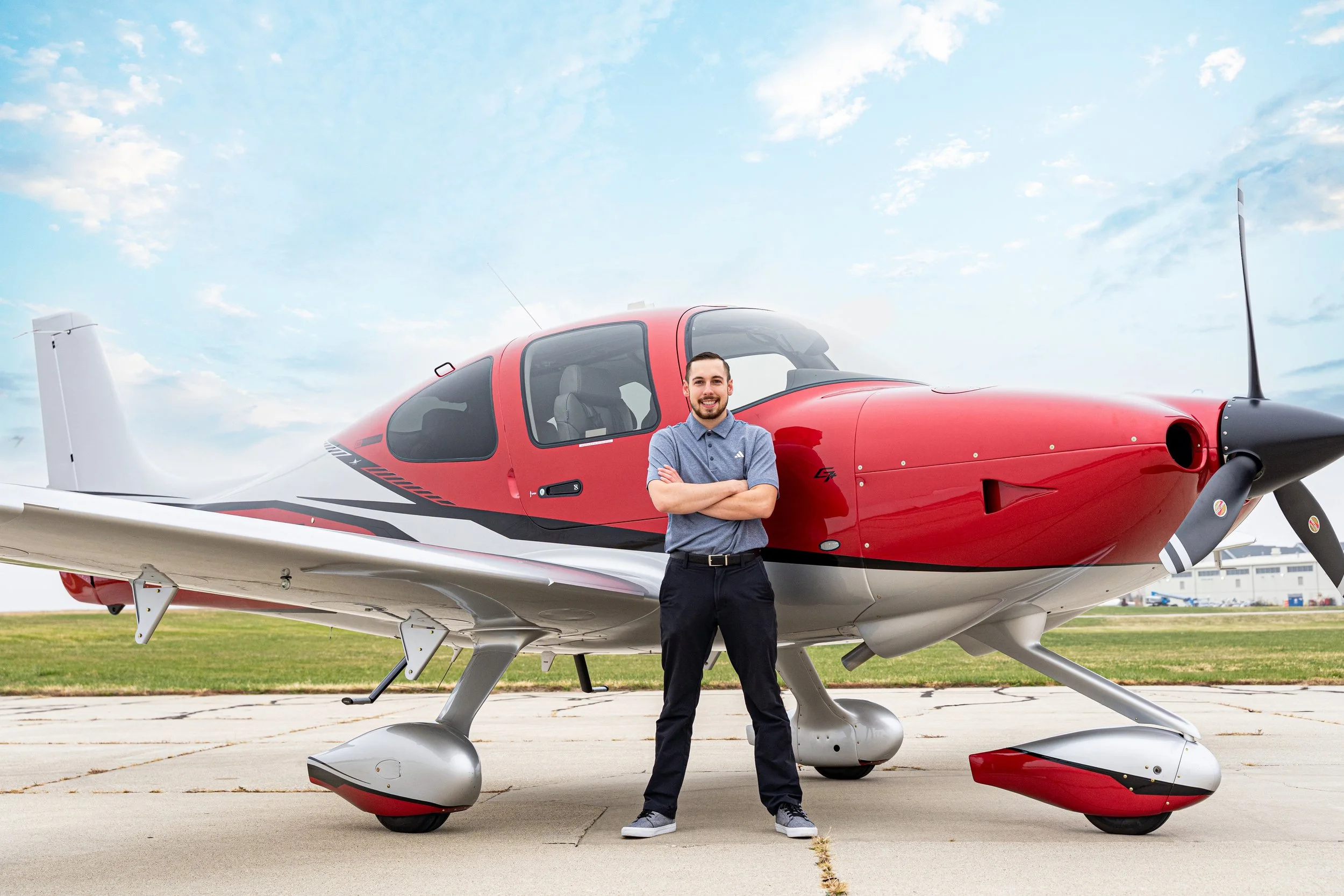 73B00370-SkyReplaced - Cirrus Red Zach Flight Instructor.jpg
