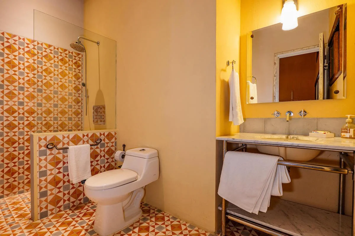 orange-tiled-bathroom-colombian-home.jpg