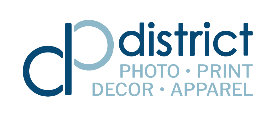 Logo for C D Photo District, offering photo, print, decor, and apparel services.