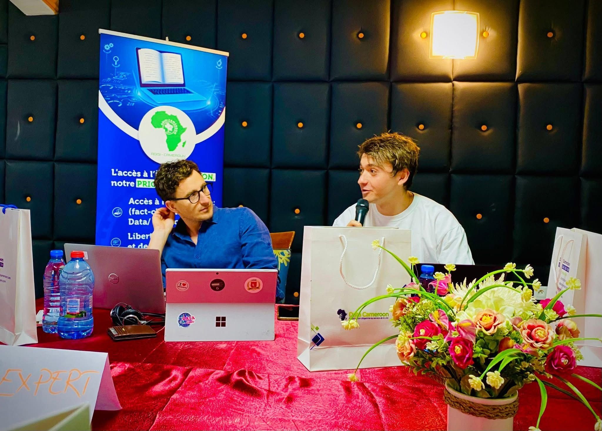 Florian Barbaro and Mathieu Kervenec during the Provenance4Trust workshop in Kribi, Cameroon, discussing AI detection and media trust.