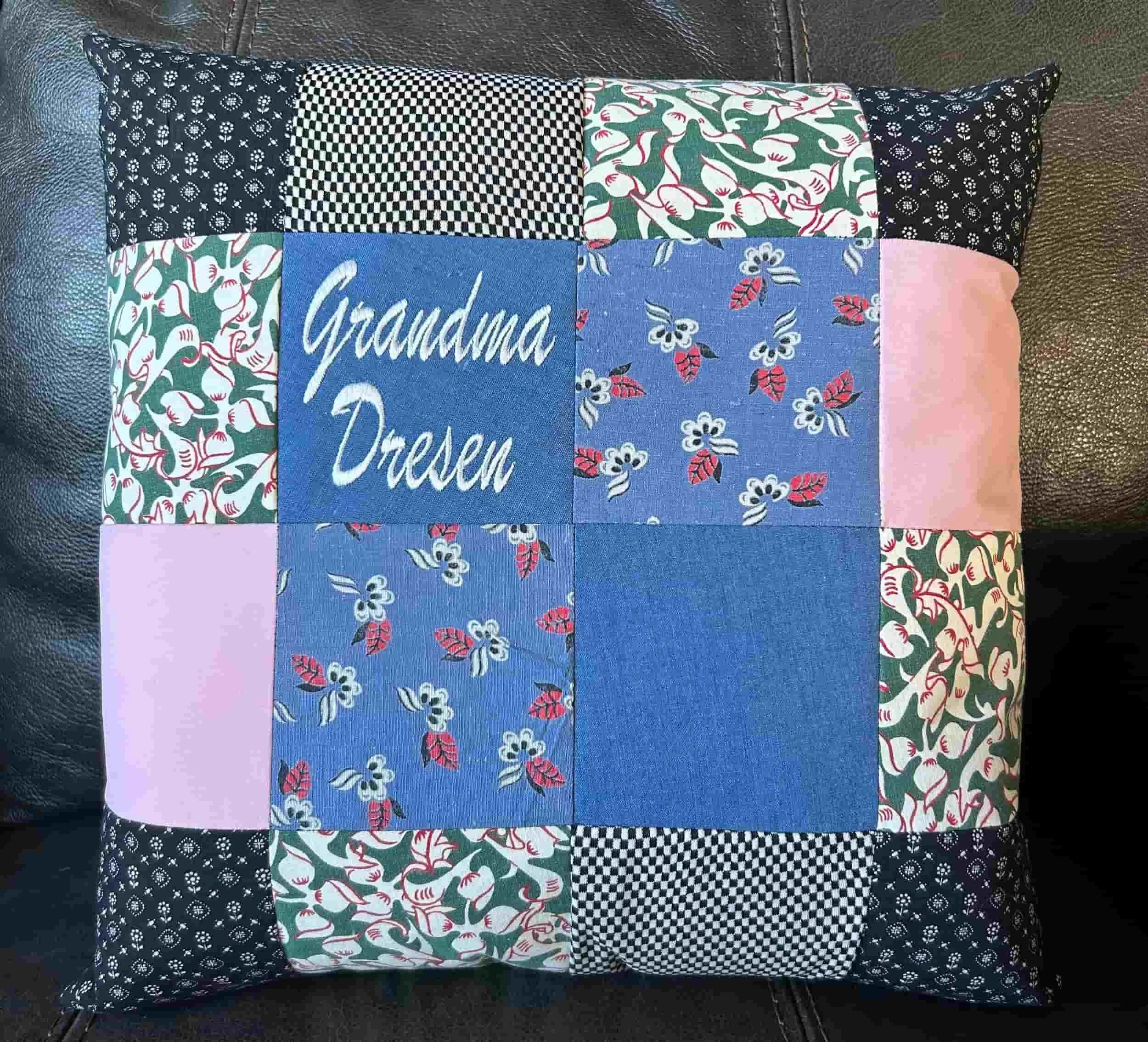 Patchwork pillow made from your clothing – custom embroidered pillow showcasing unique fabric squares.