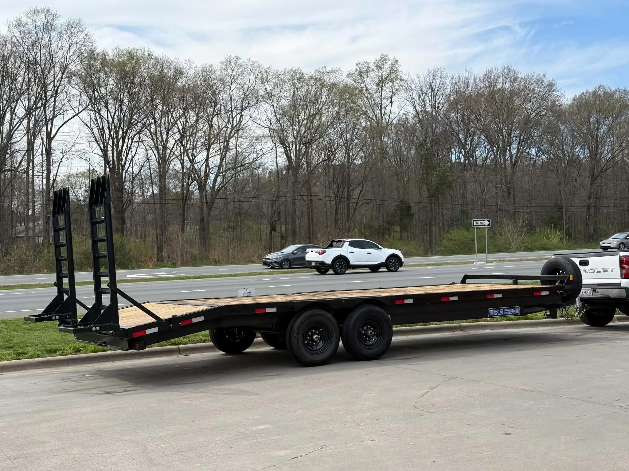 24ft deckover trailer rental near Charlotte NC — heavy duty flatbed with ramps