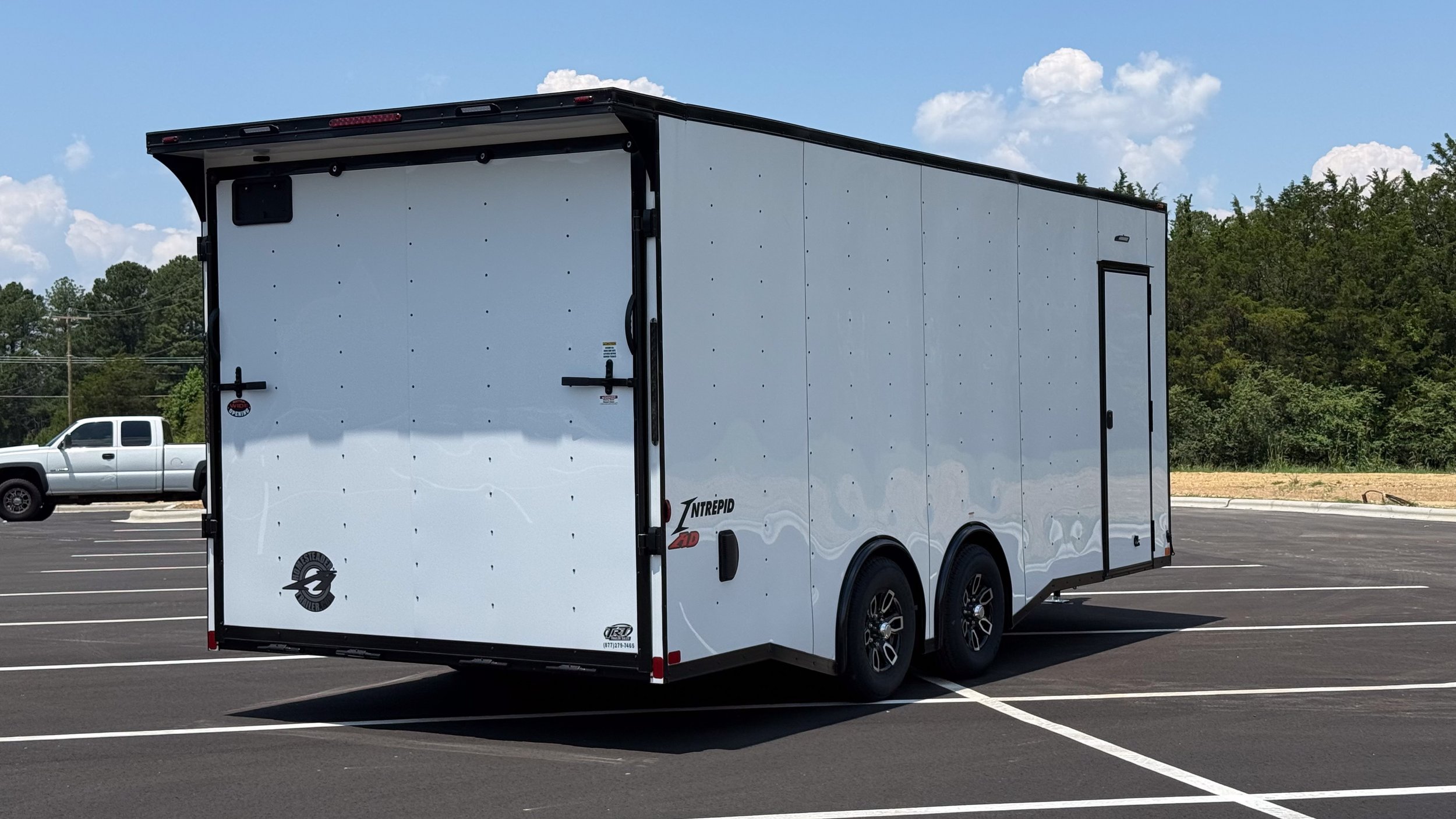 20-foot enclosed trailer rental near Charlotte NC — side door and aluminum wheels