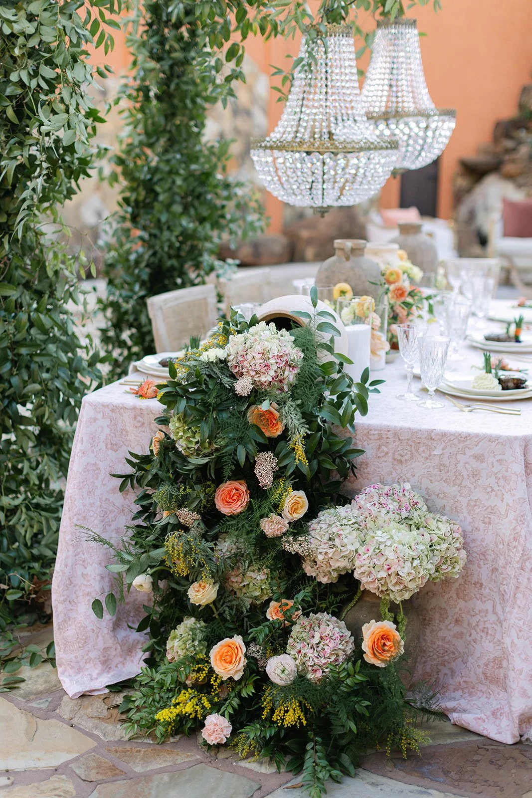Flowers cascading down a long decorated table at Agave Estates in Houston TX