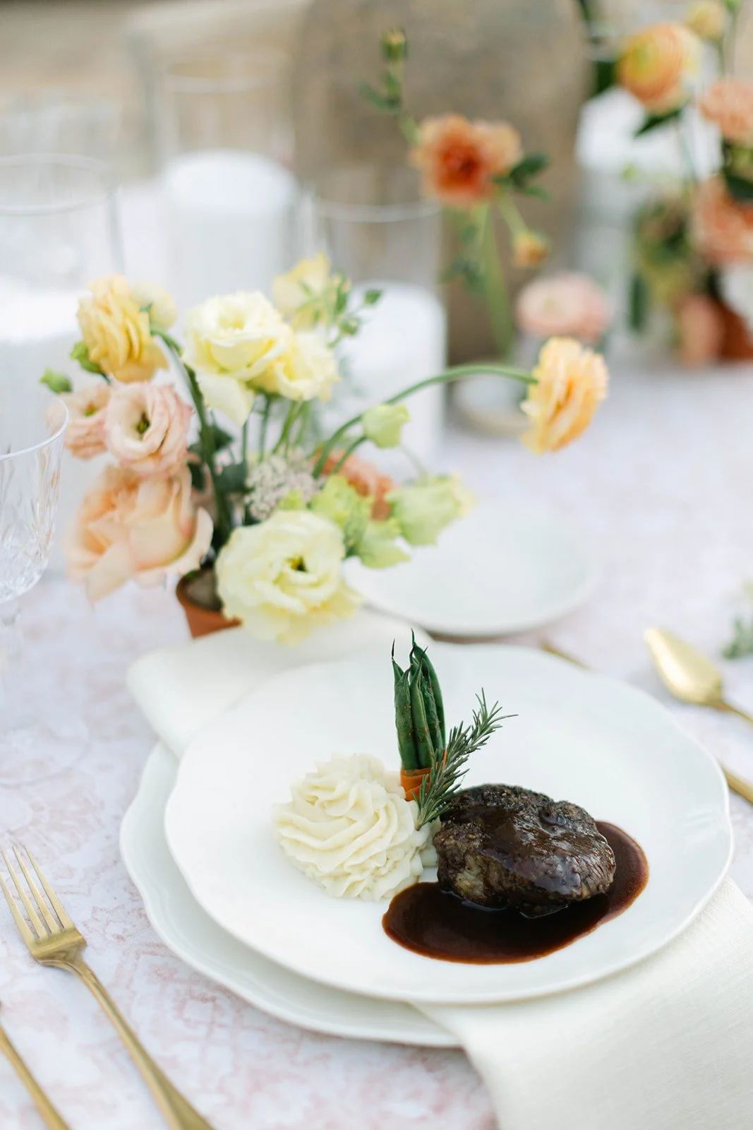 A dinner of steak and mashed potatoes served at a wedding table at Agave Estates in Houston TX