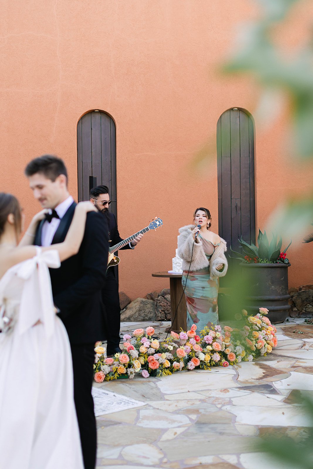 A bride and groom dancing to music by live musicians at Agave Estates in Houston TX