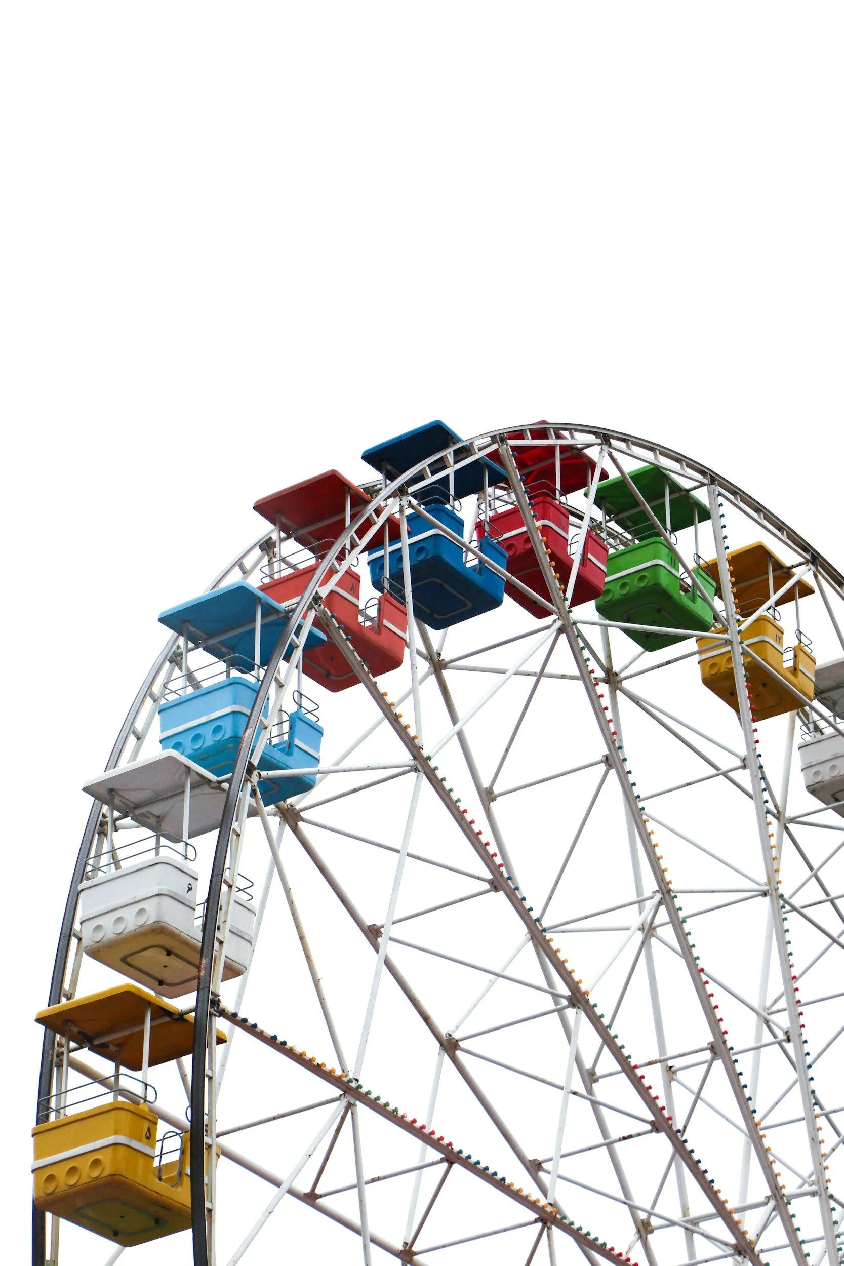 Colorful Ferris wheel with various gondolas in red, blue, green, yellow, and white, against a white sky.