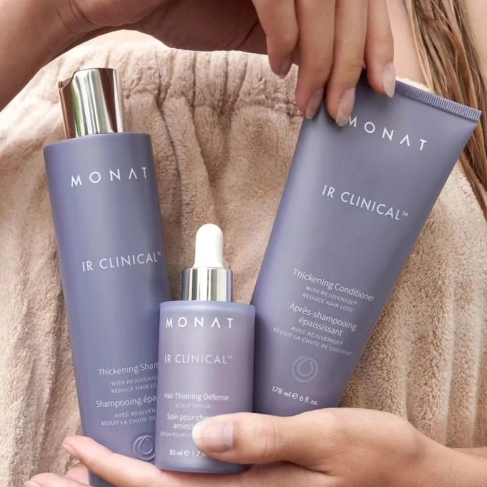 Three Monat IR Clinical hair care products: a thickening shampoo, a thickening conditioner, and a hair thinning defense serum.