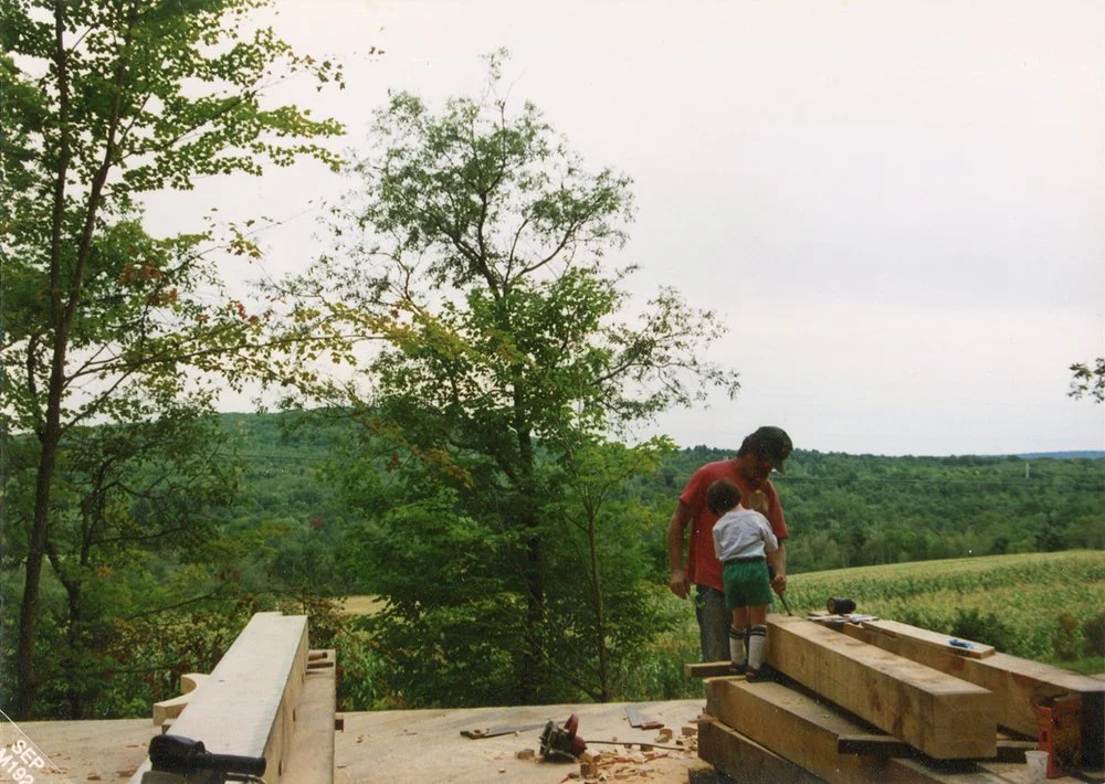 Zach helps notch mortises in the pine beams.