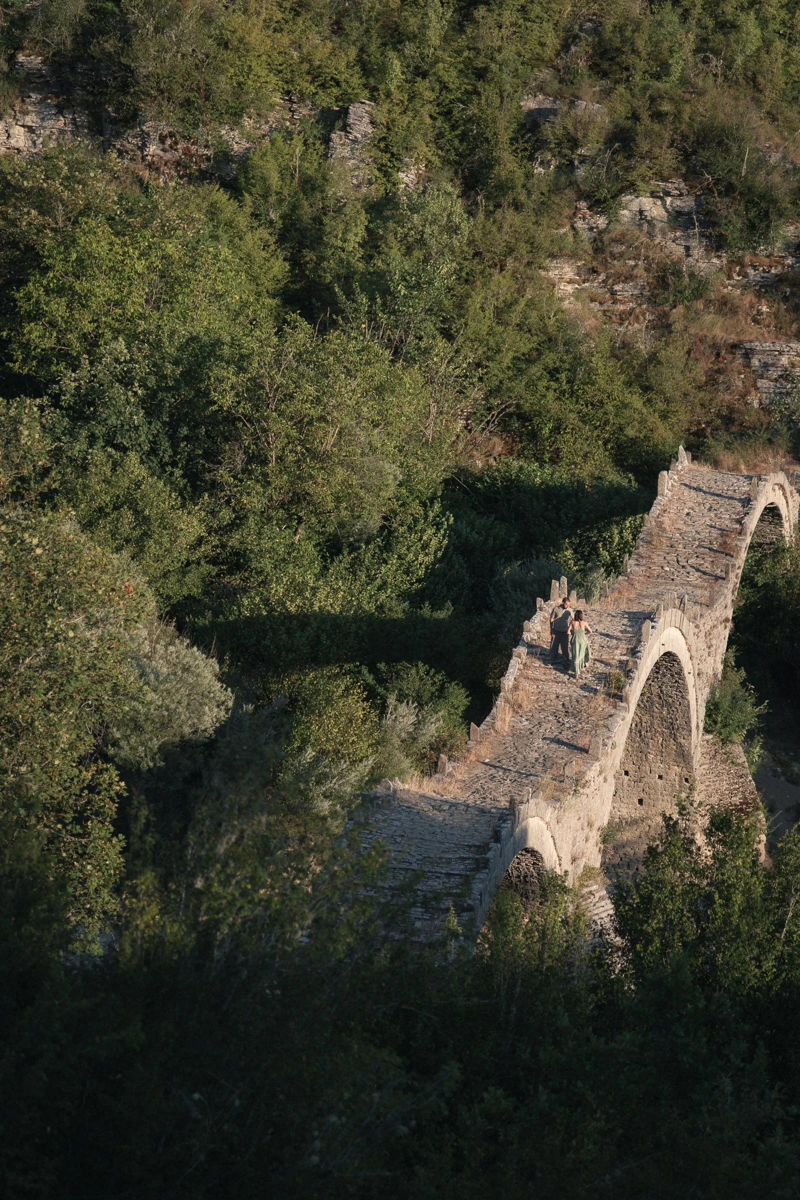 Couple on stone bridge, Zagori, aerial - Alexandros Aidonis