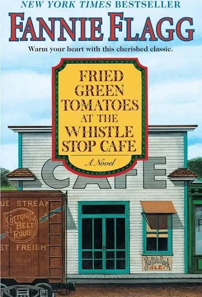 cover of Fannie Flagg's Fried Green Tomatoes at the Whistle Stop cafe, the front of a white building with old timey slats