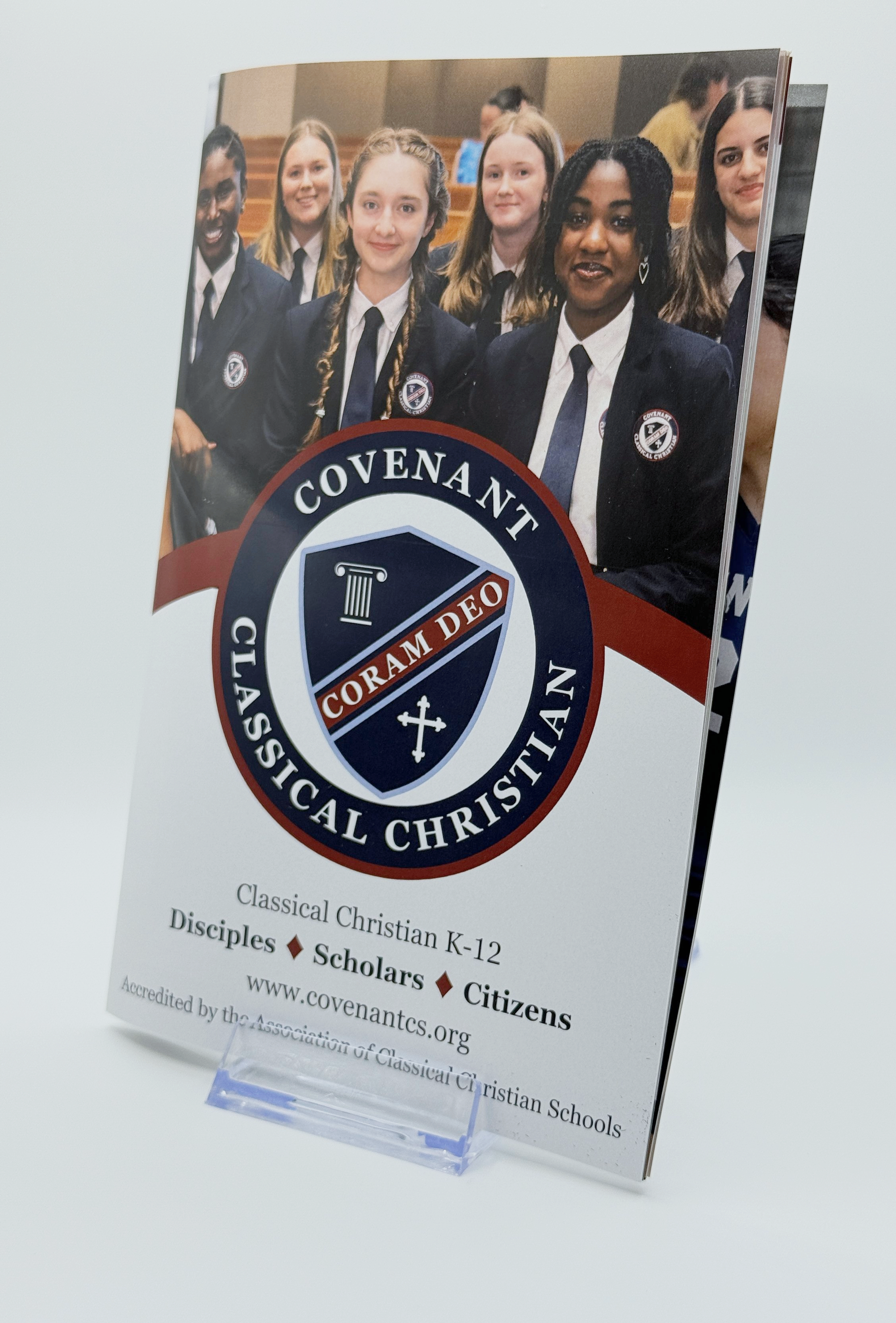 Brochure for Covalent Classical Christian school featuring a group of students in uniform inside a church or school auditorium.