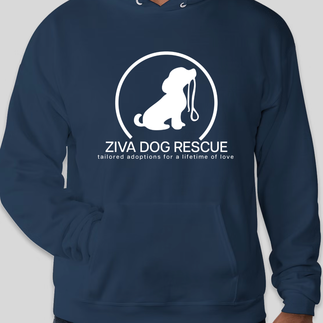 Navy hoodie with Ziva Dog Rescue logo featuring a white silhouette of a dog inside a circle, with the text 'Ziva Dog Rescue' and 'tailored adoptions for a lifetime of love'.