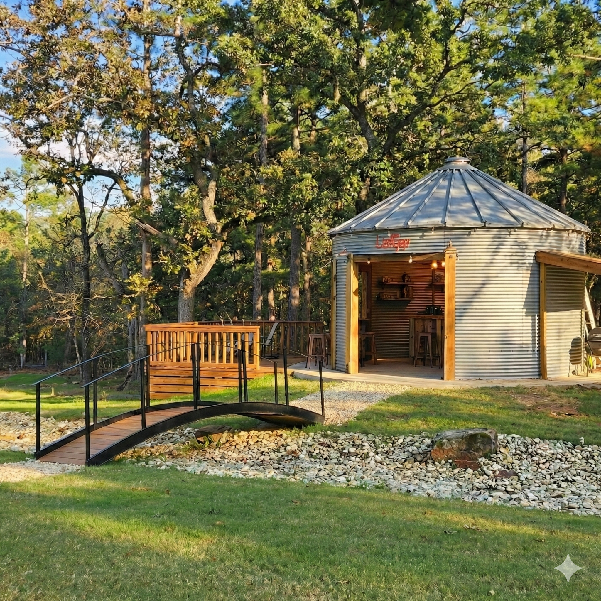 Custom-converted outdoor Silo Bar and wooden walkway at Larue Landing, a unique group entertainment space for weekend getaways in East Texas.